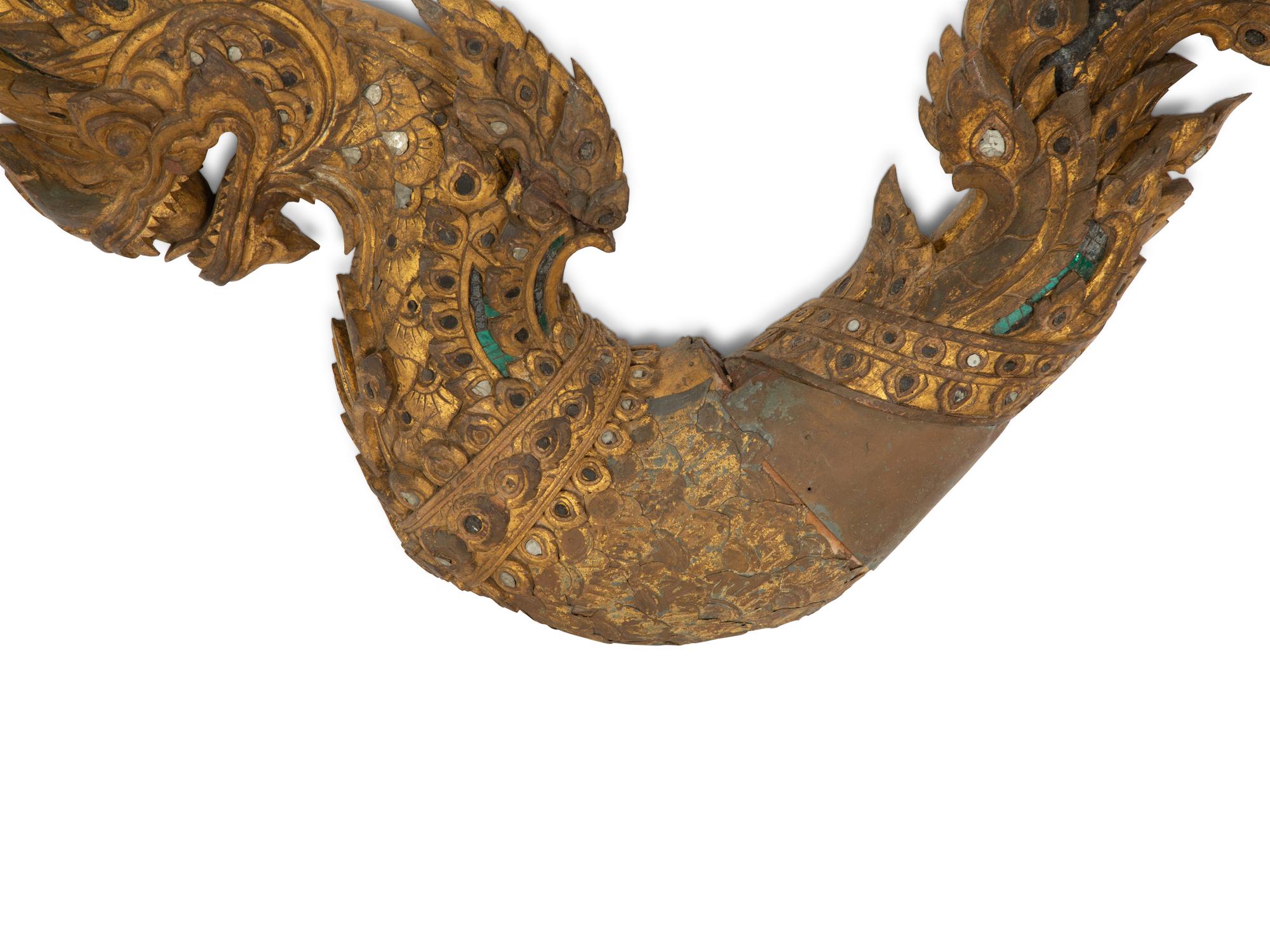 A Large Thai Giltwood and Mirror-Inset Dragon Ornament