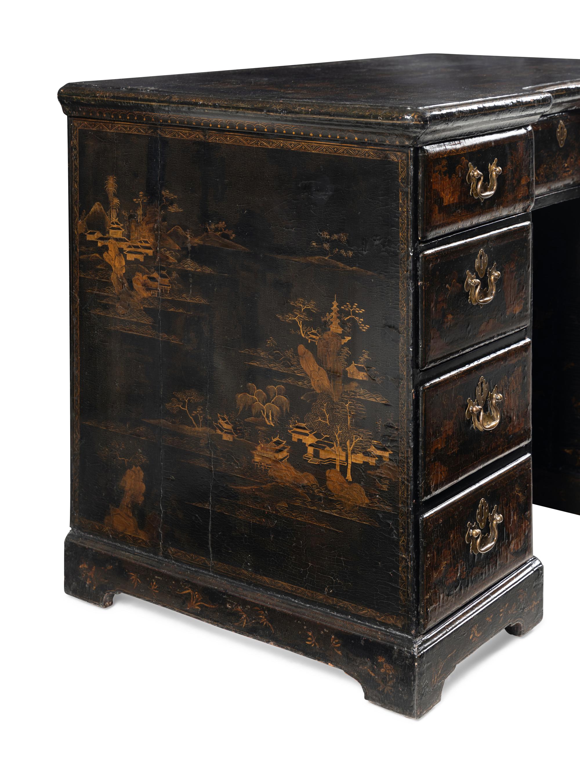 A Chinese Export Black and Gilt Lacquered Kneehole Desk
