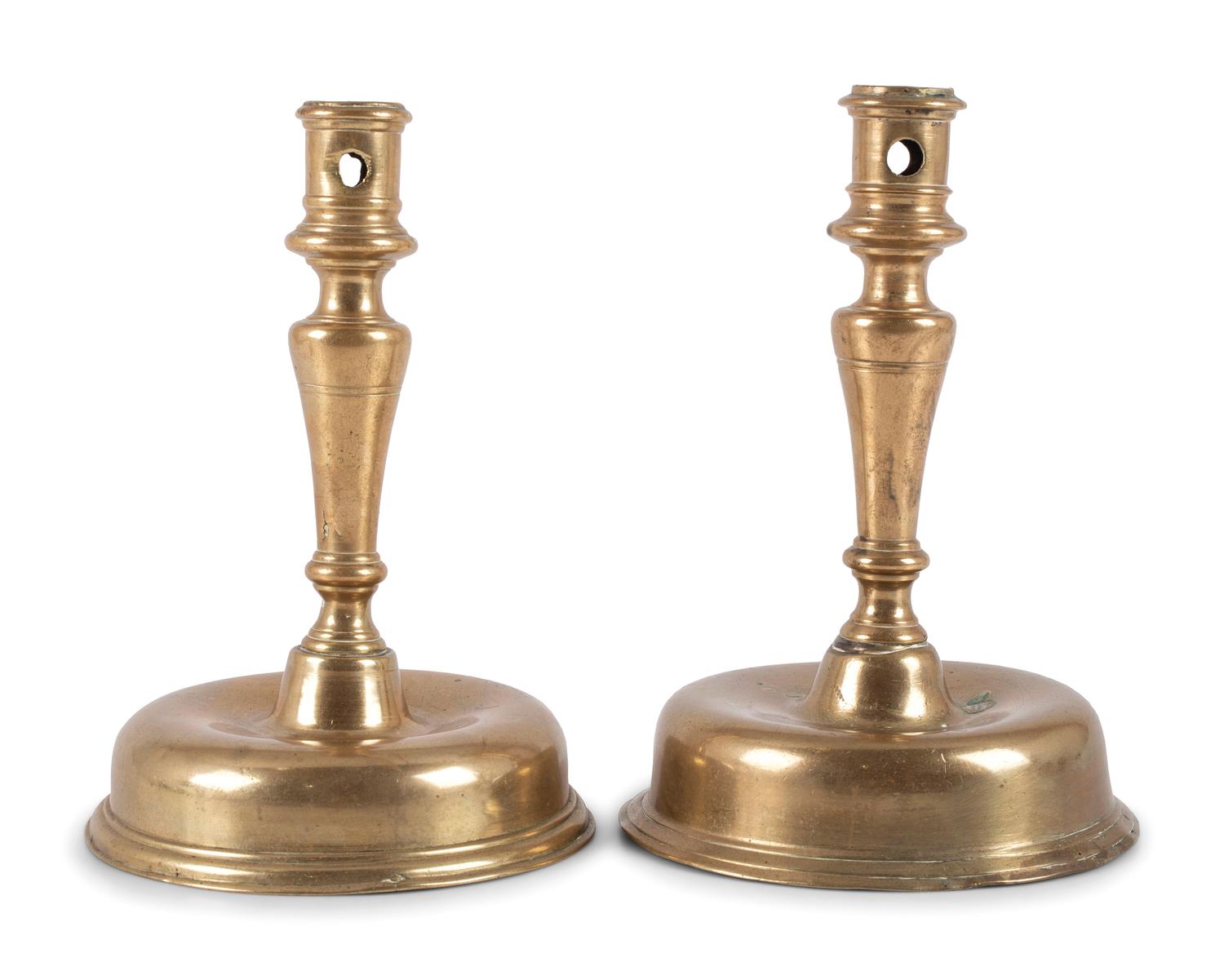 A Pair of Spanish Brass Low Bell Candlesticks