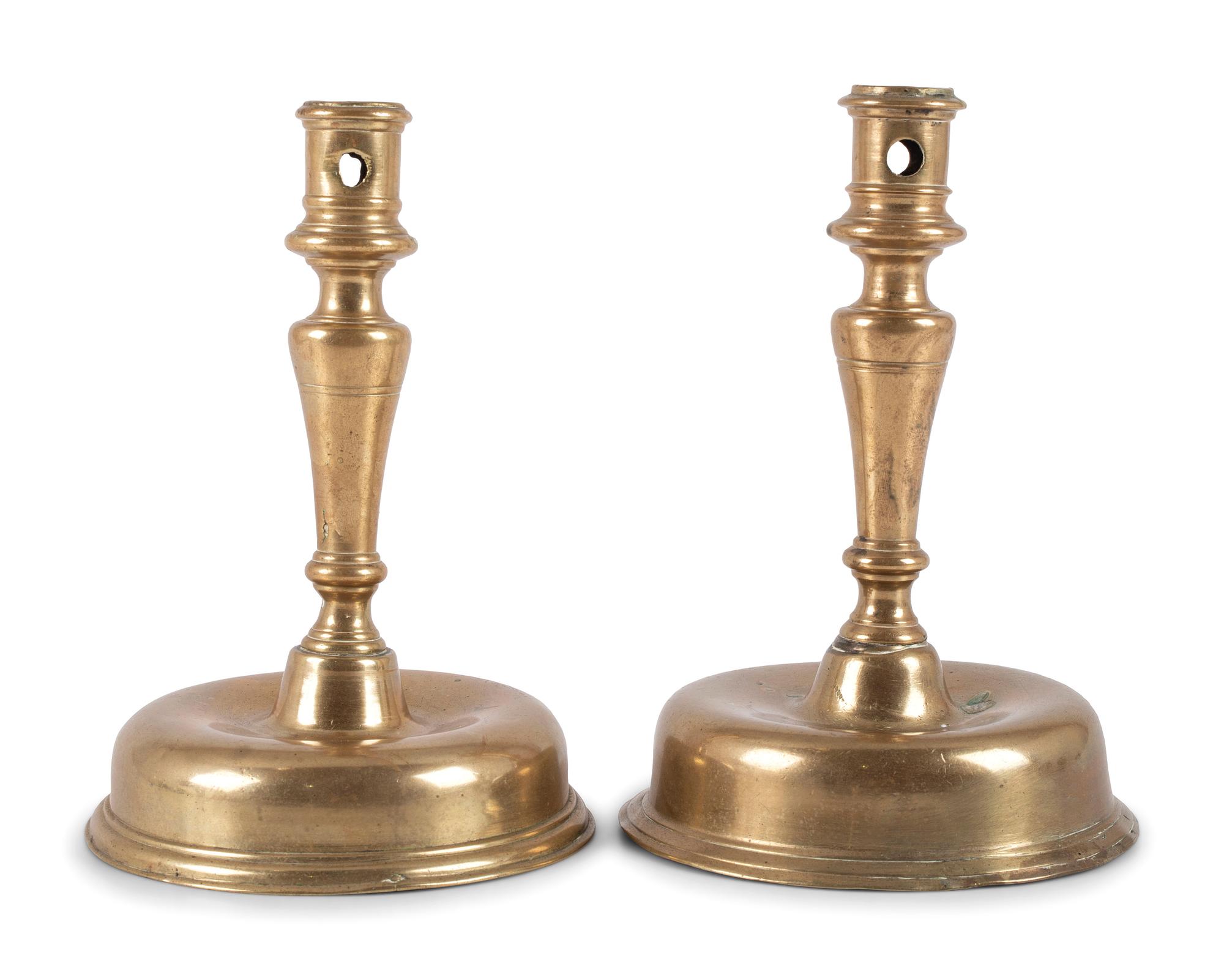 A Pair of Spanish Brass Low Bell Candlesticks
