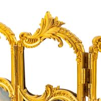 A French Gilt Bronze, Enameled Copper and Glass Table Screen