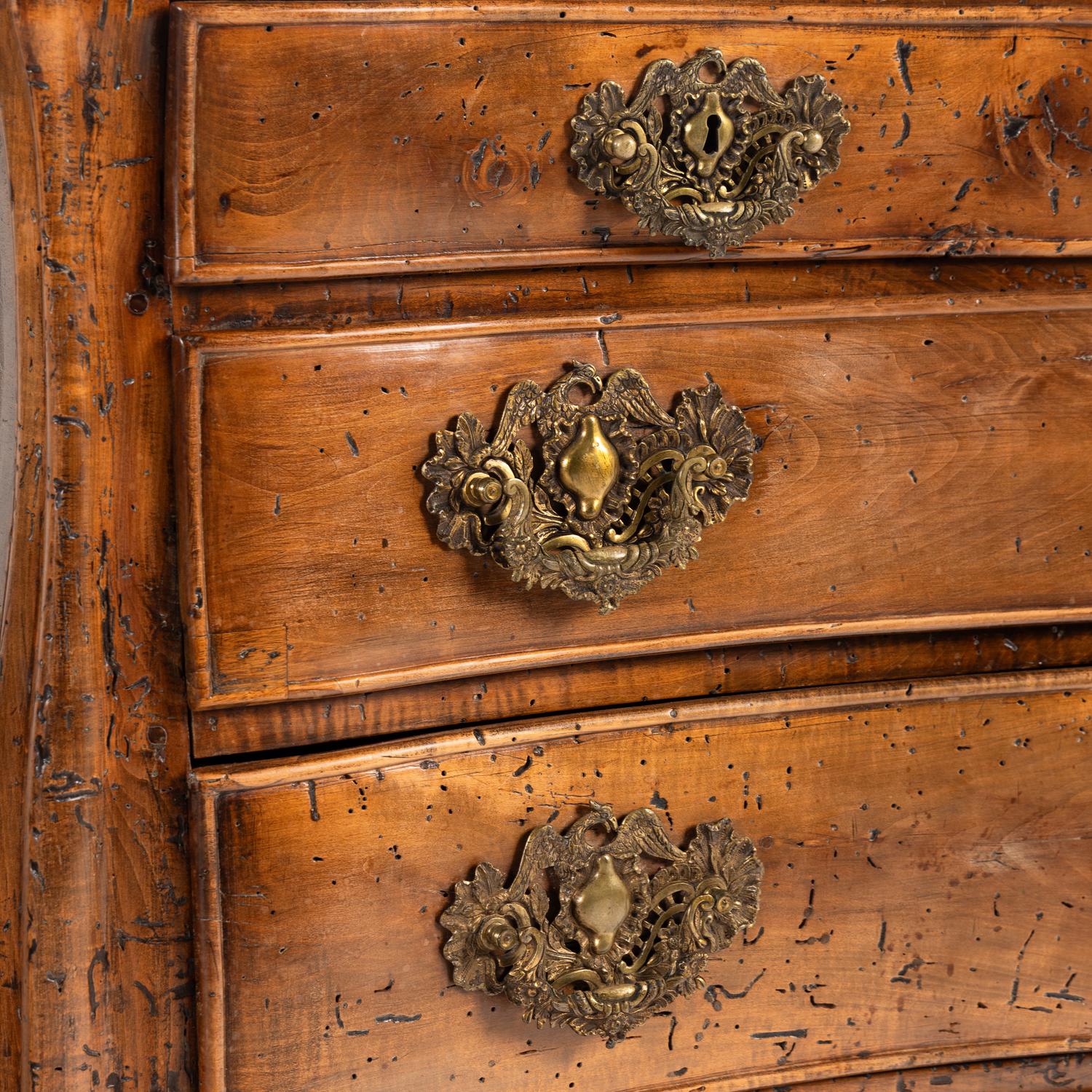 A Pair of Continental Walnut Chests of Drawers