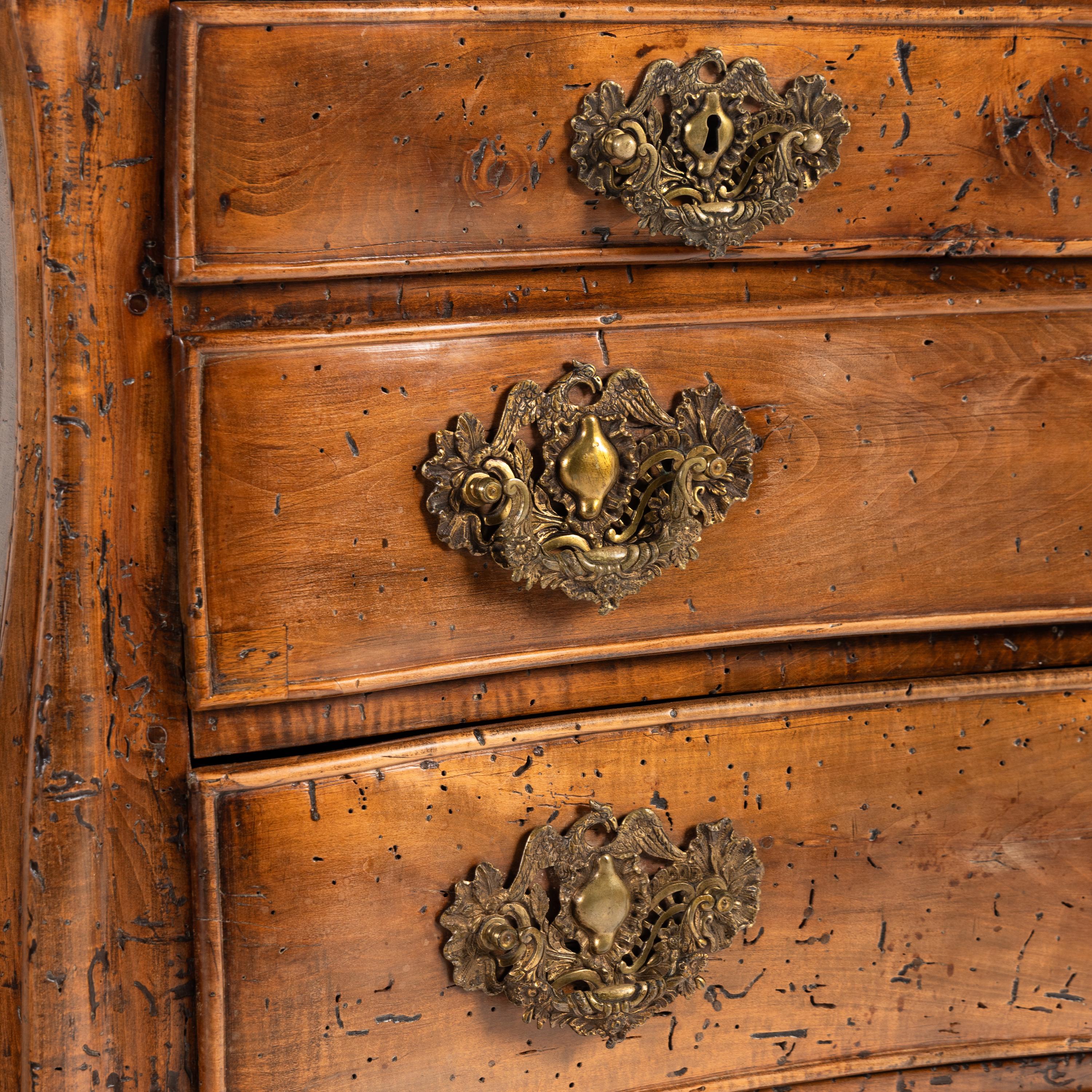A Pair of Continental Walnut Chests of Drawers