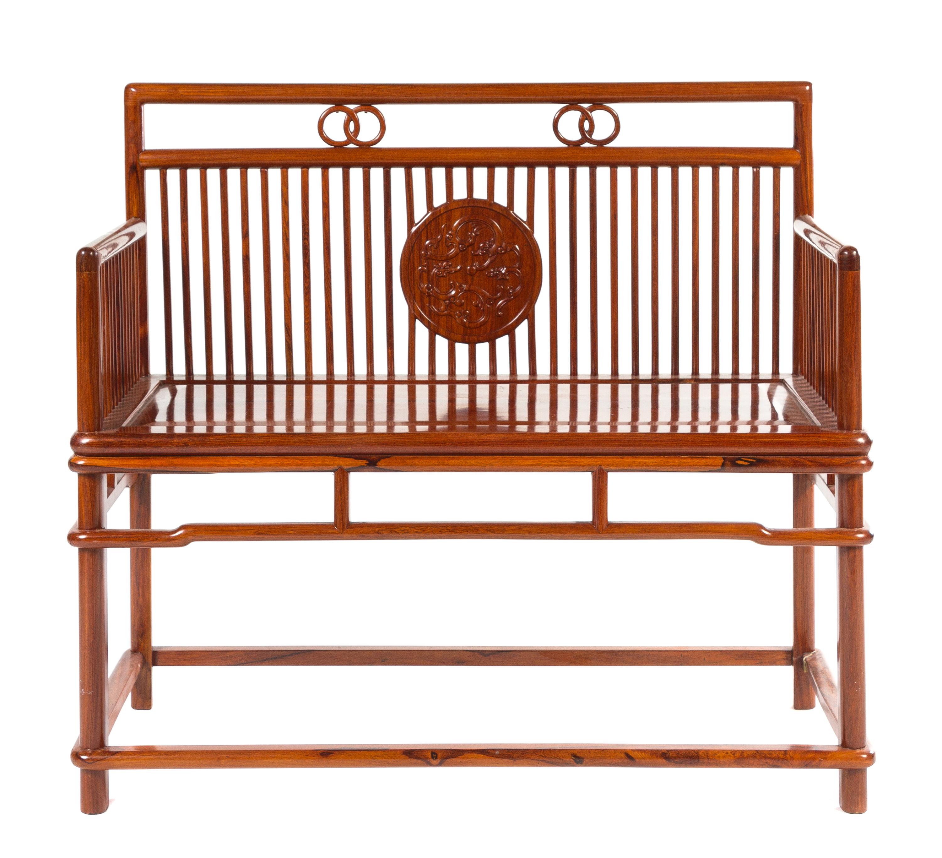 A Chinese Rosewood Bench Height 35 3/4 x width 38 3/8 x depth 18 inches.