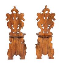 A Pair of Italian Carved Walnut Sgabello Chairs