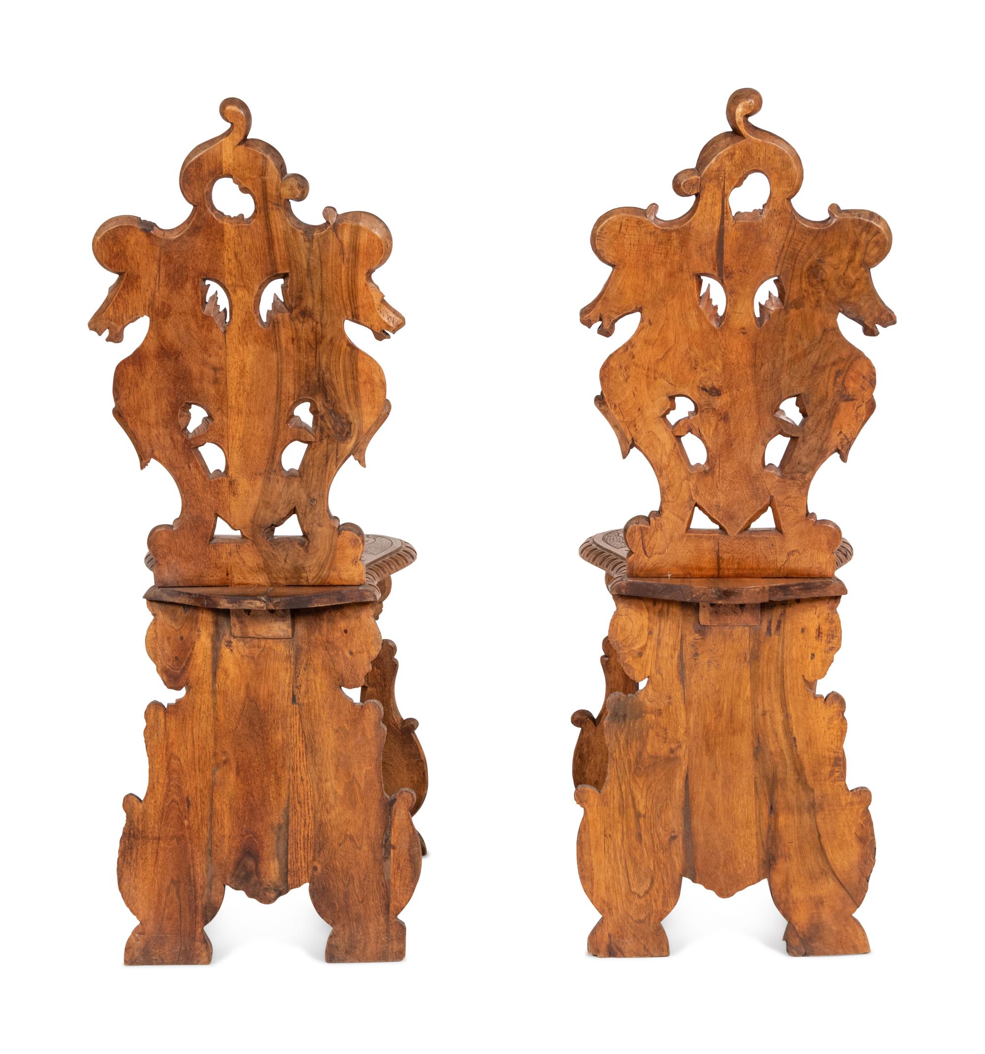 A Pair of Italian Carved Walnut Sgabello Chairs