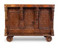 An Indian Carved Wood Traveling Trunk on Wheels — 19TH/20TH CENTURY