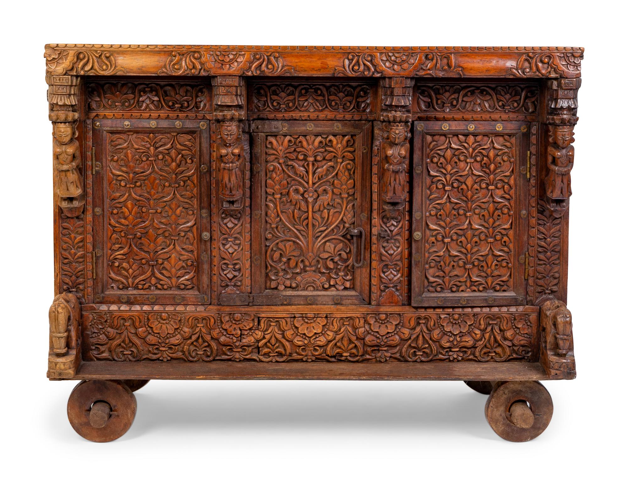 An Indian Carved Wood Traveling Trunk on Wheels — 19TH/20TH CENTURY