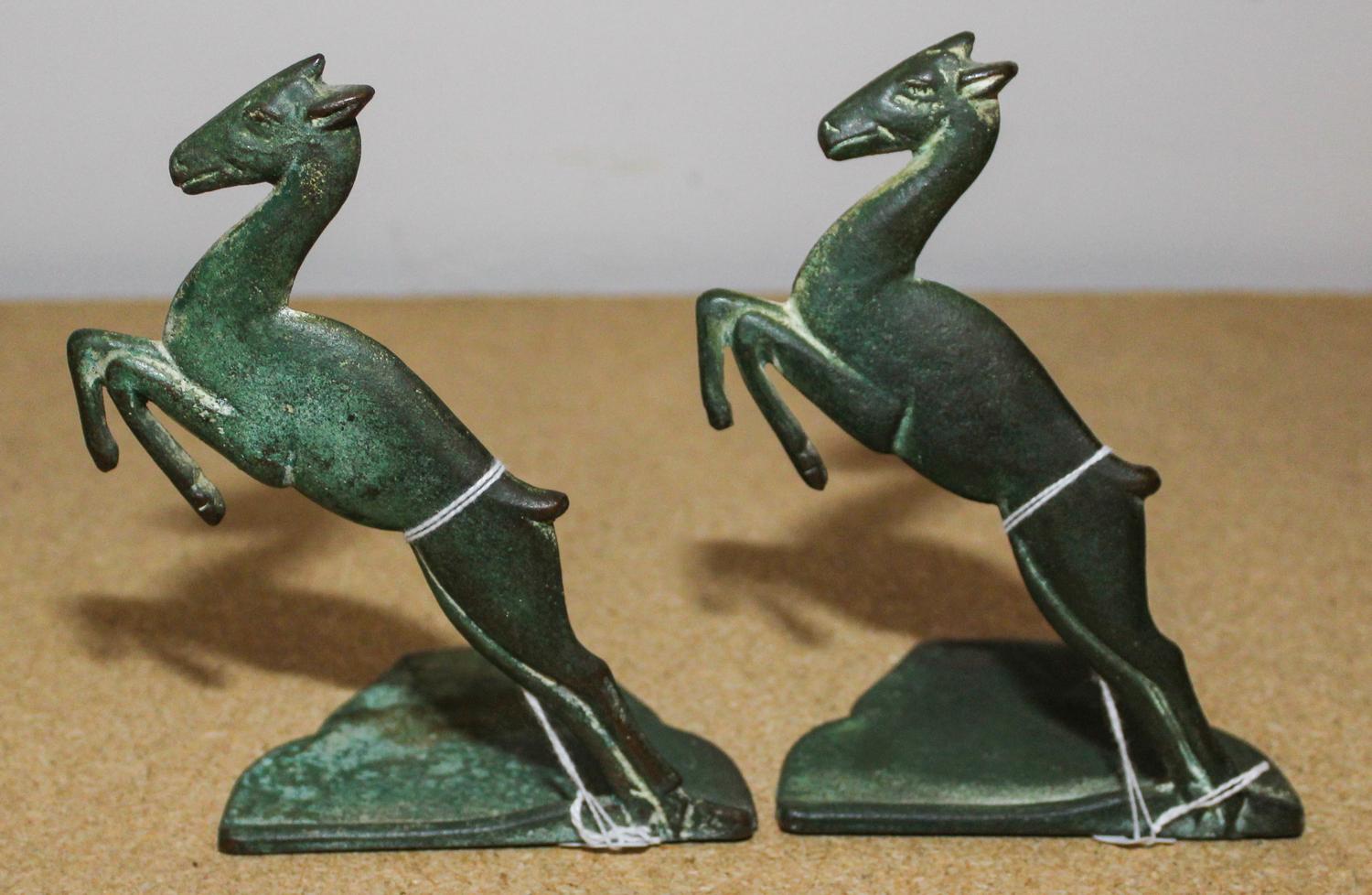A Pair of Cast Metal Bookends Height of each 6 inches. — FIRST HALF 20TH CENTURY