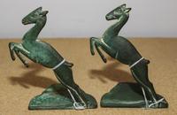 A Pair of Cast Metal Bookends Height of each 6 inches. — FIRST HALF 20TH CENTURY