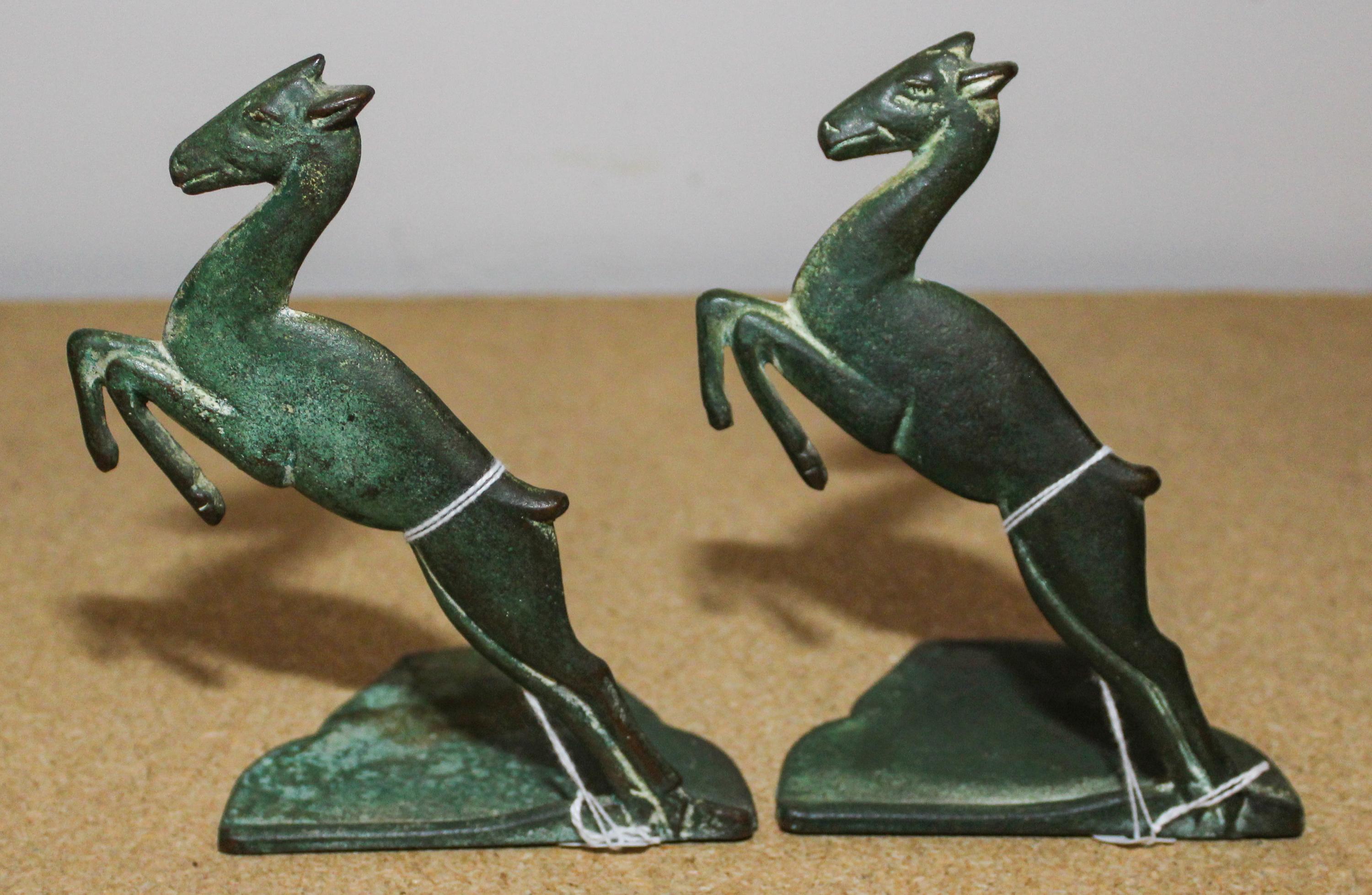 A Pair of Cast Metal Bookends Height of each 6 inches. — FIRST HALF 20TH CENTURY