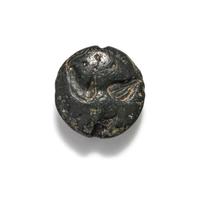 A Minoan Black Steatite Lentoid with a Bull Head and Leaf.