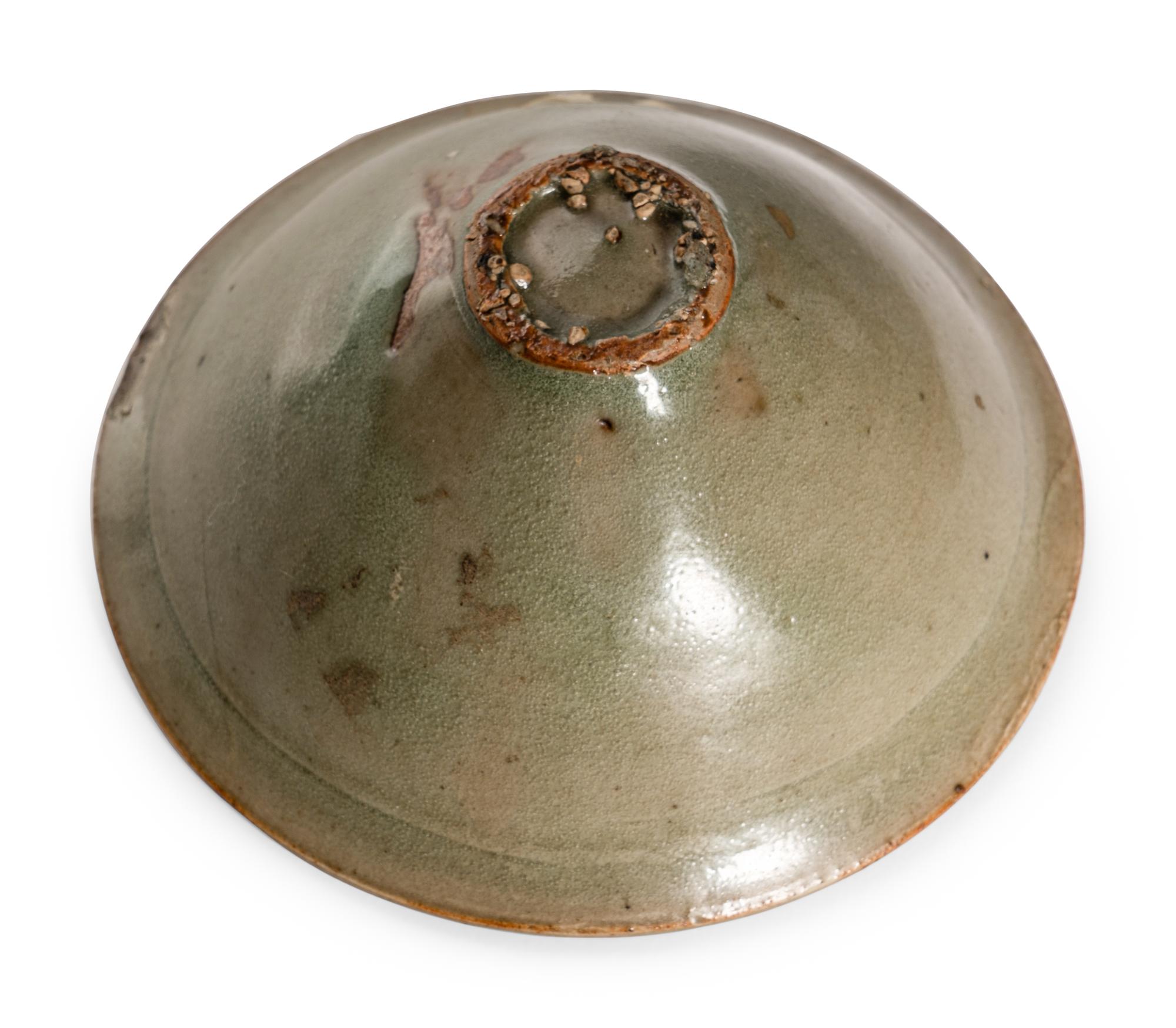 Two Celadon Glazed Porcelain Tea Bowls