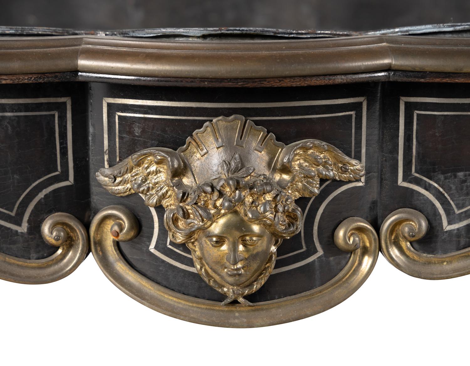 A Napoleon III Gilt Bronze Mounted Ebonized Jardinière Table