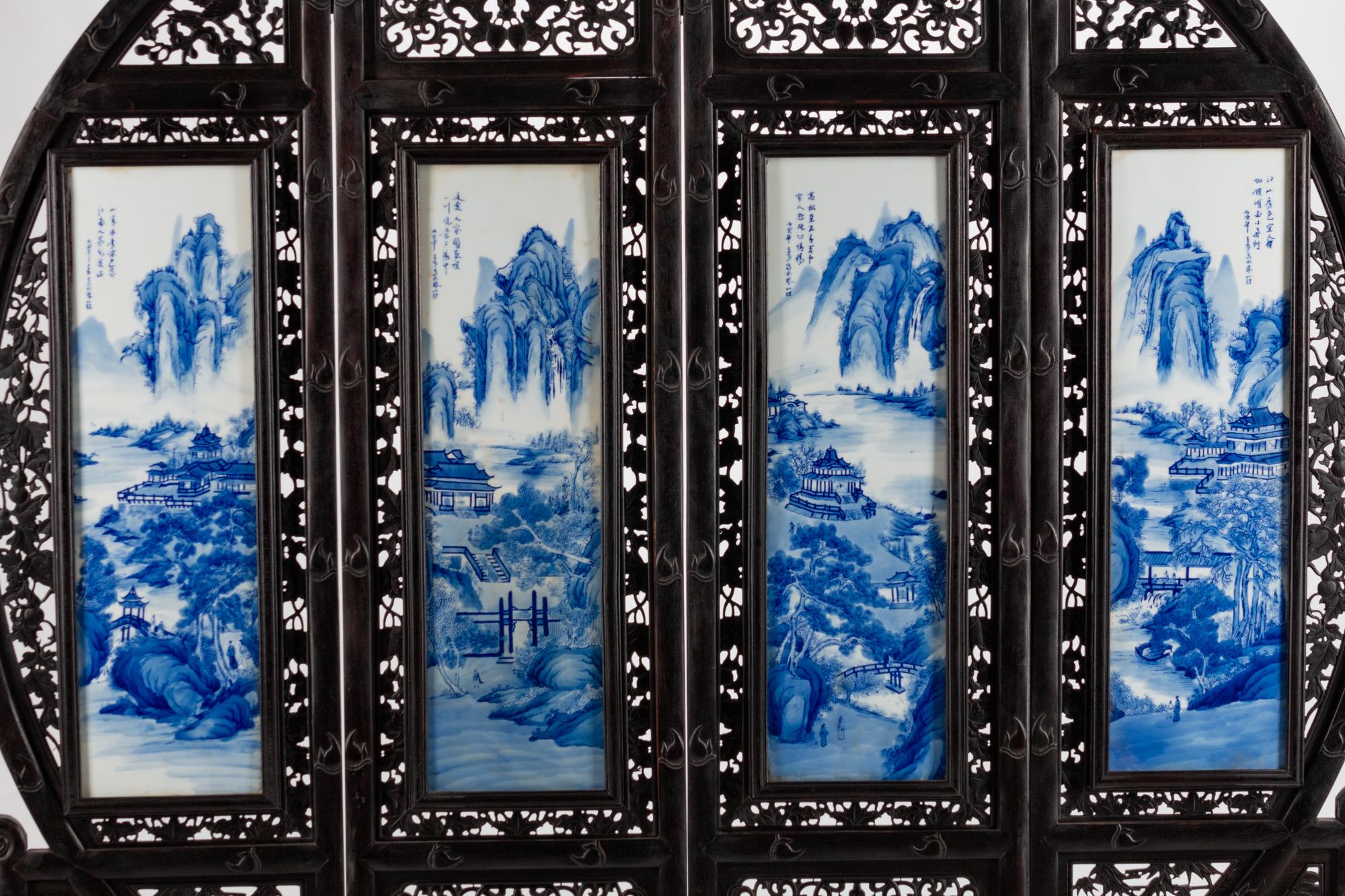 A Chinese Blue and White Porcelain-Mounted Carved Hardwood Four Panel Floor Screen