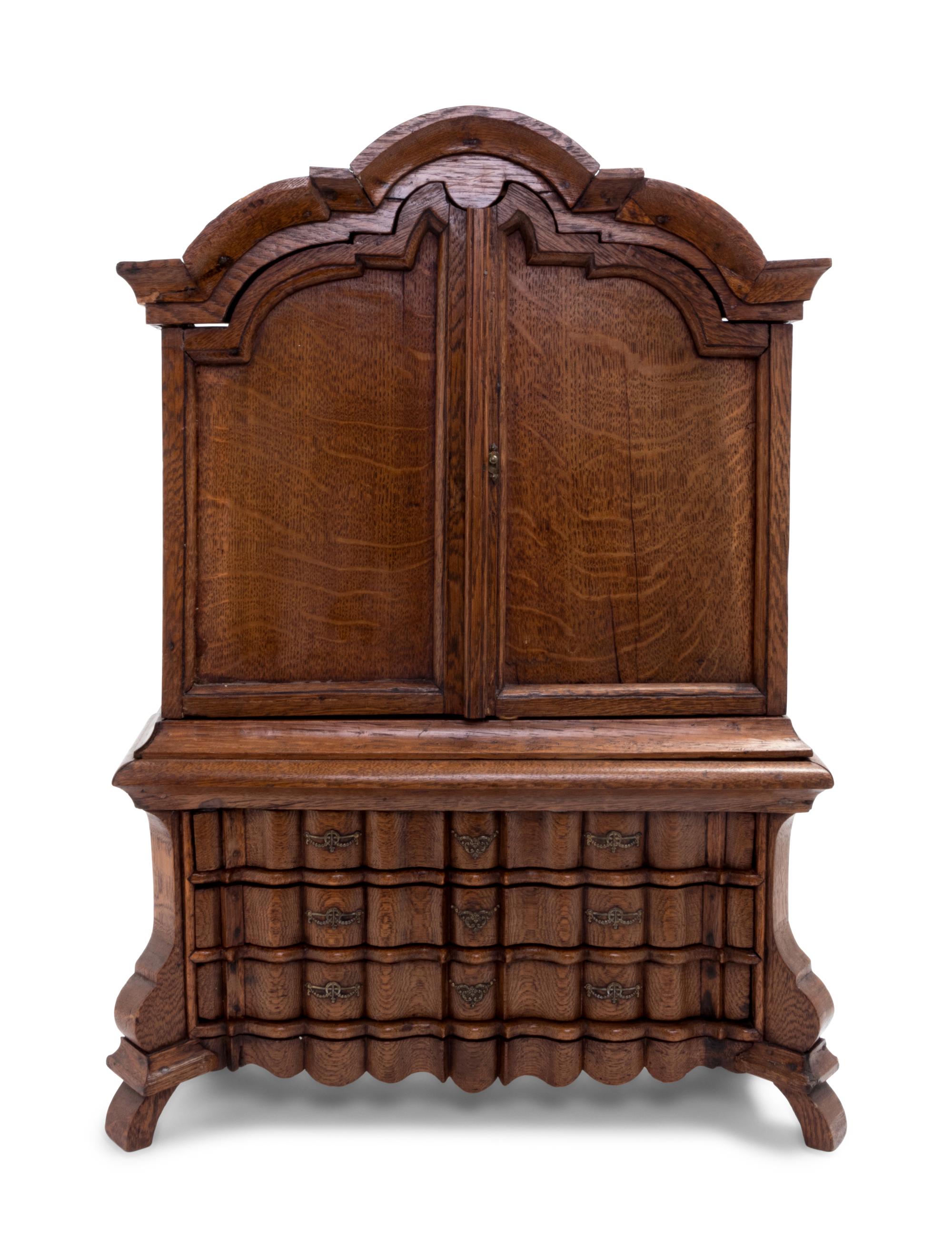 A Continental Oak Diminutive Cabinet