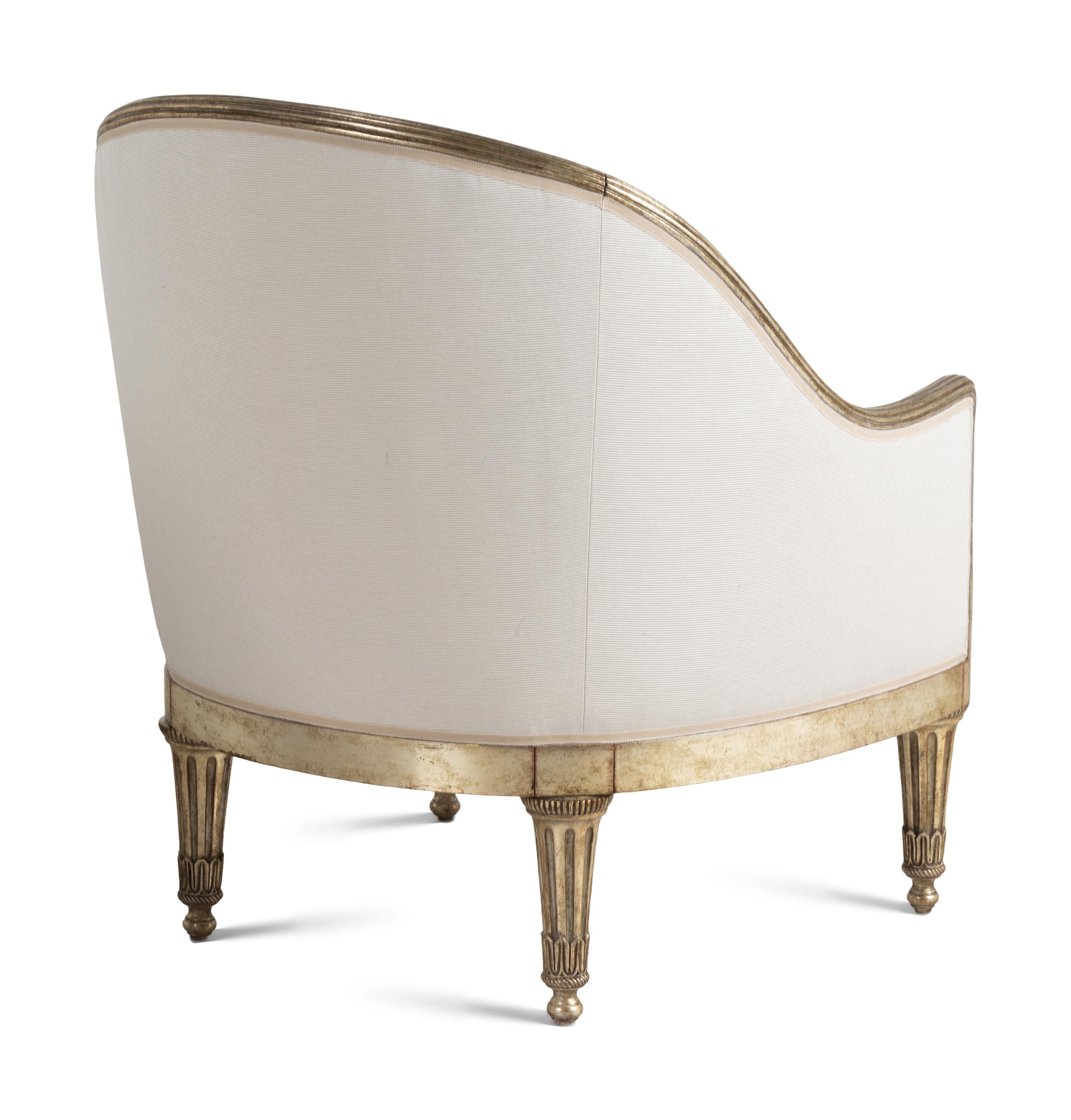 A Pair of Ebanista Silvered Wood Bergeres