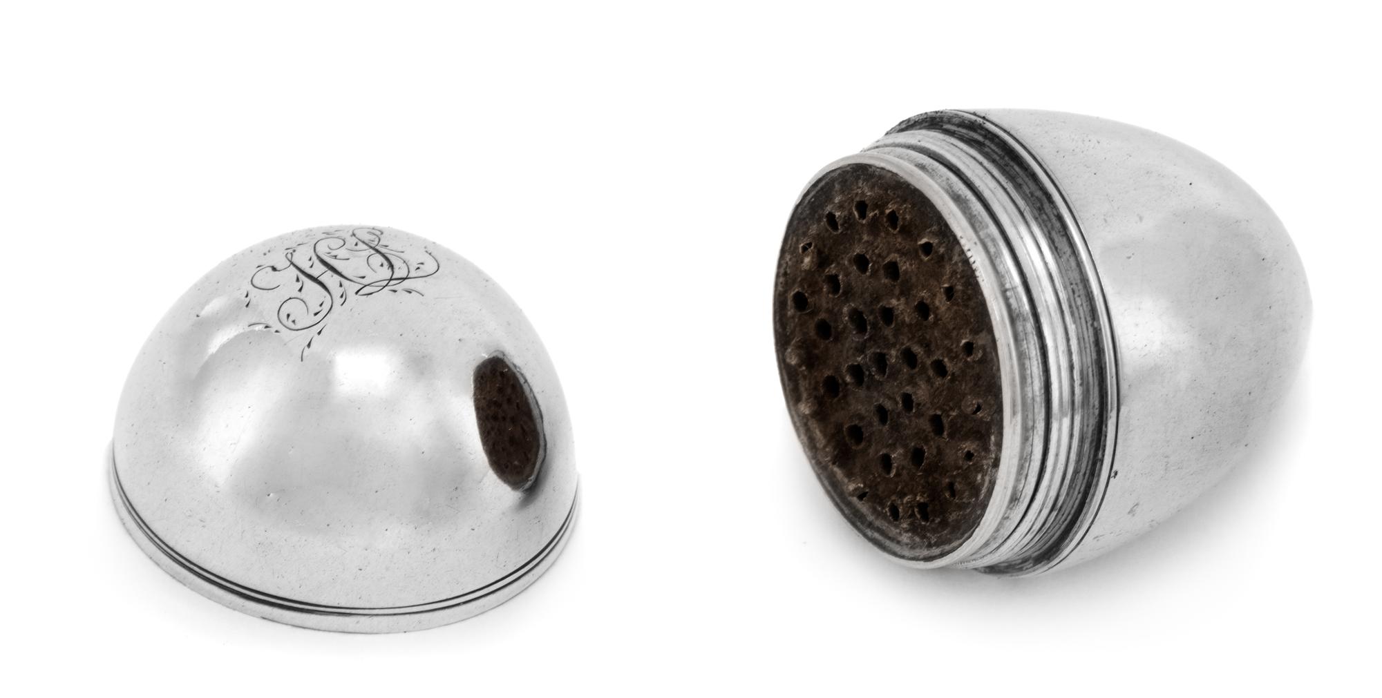 A George III Silver Nutmeg Grater, Likely John Thornton, Birmingham, 1803, of ovoid form, the underside with engraved monogram HL.