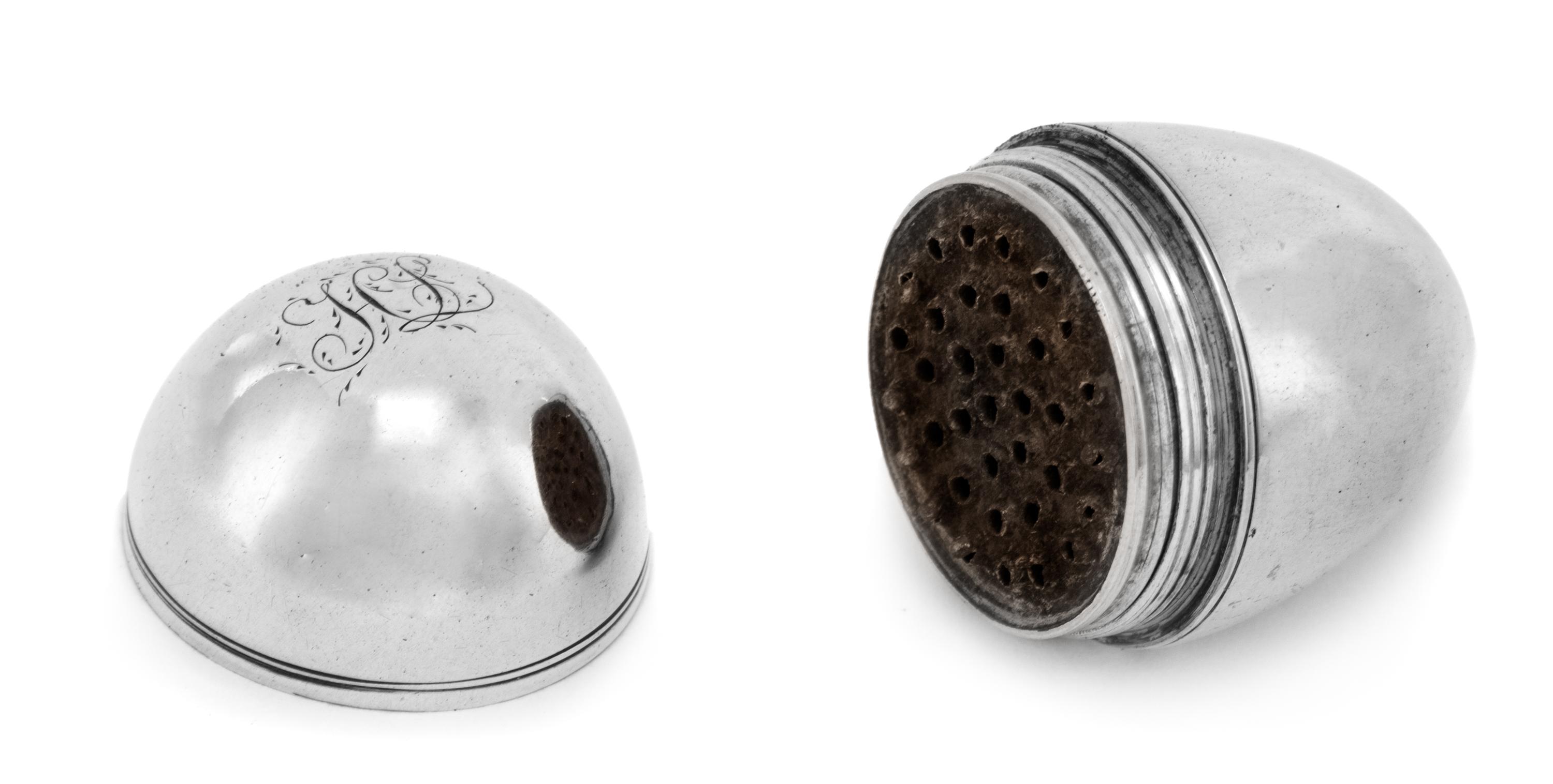A George III Silver Nutmeg Grater, Likely John Thornton, Birmingham, 1803, of ovoid form, the underside with engraved monogram HL.