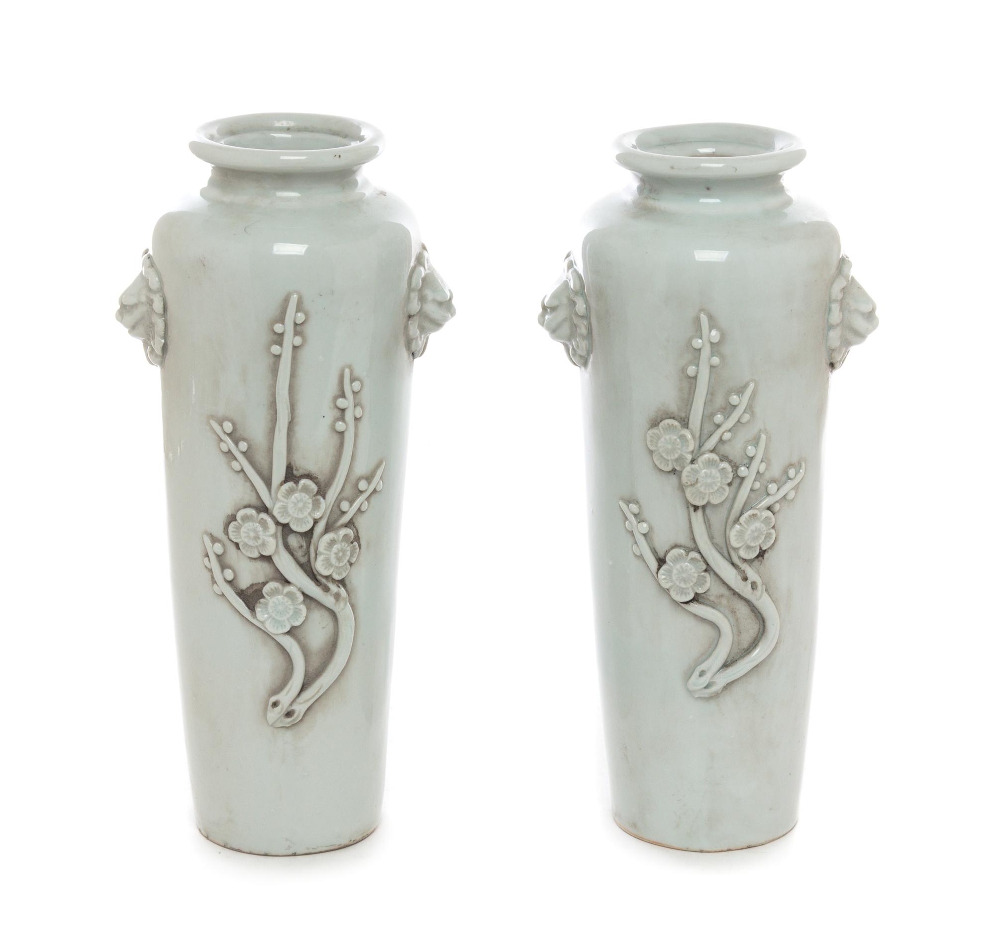 A Pair of Chinese White Glazed Porcelain Vases Height 10 1/4 inches.