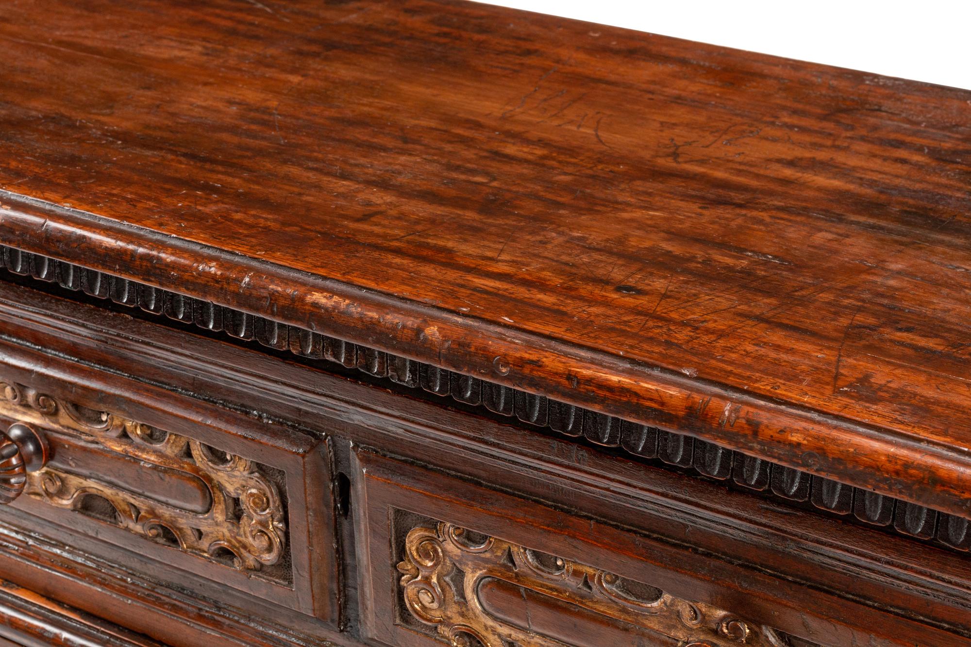An Italian Baroque Parcel Gilt Walnut Chest of Drawers