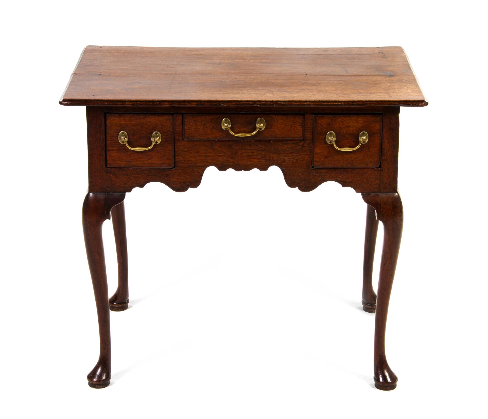 An English Oak Lowboy, Height 27 3/4 x width 31 3/8 x depth 19 1/2 inches.