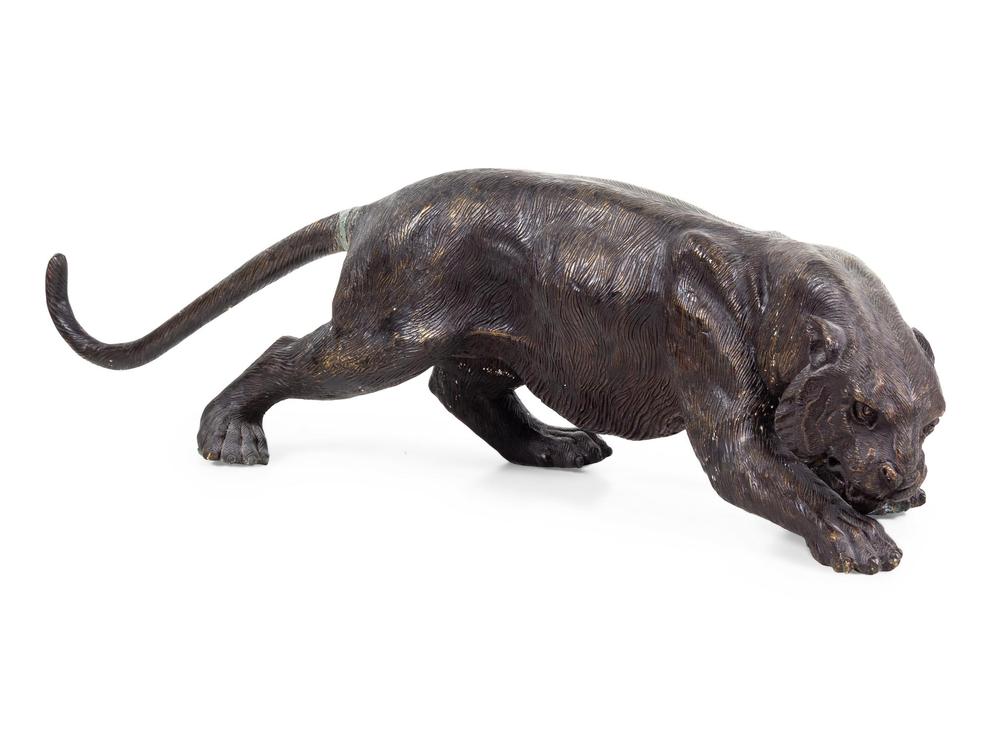A Cast Metal Figure of a Leopard
