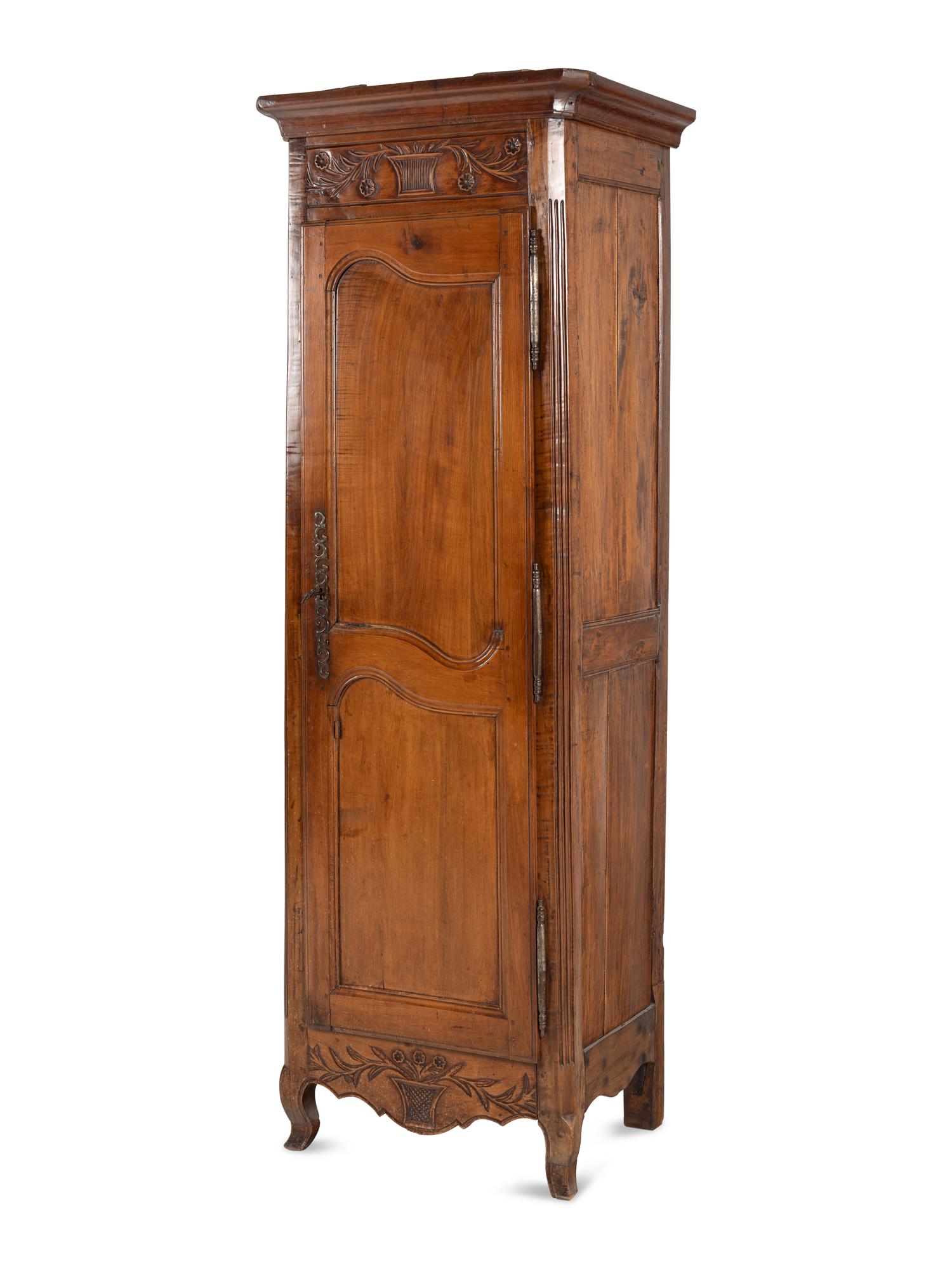 A Louis XV Provincial Walnut Cabinet