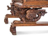 An Italian Renaissance Revival Carved Walnut Cassone on Stand