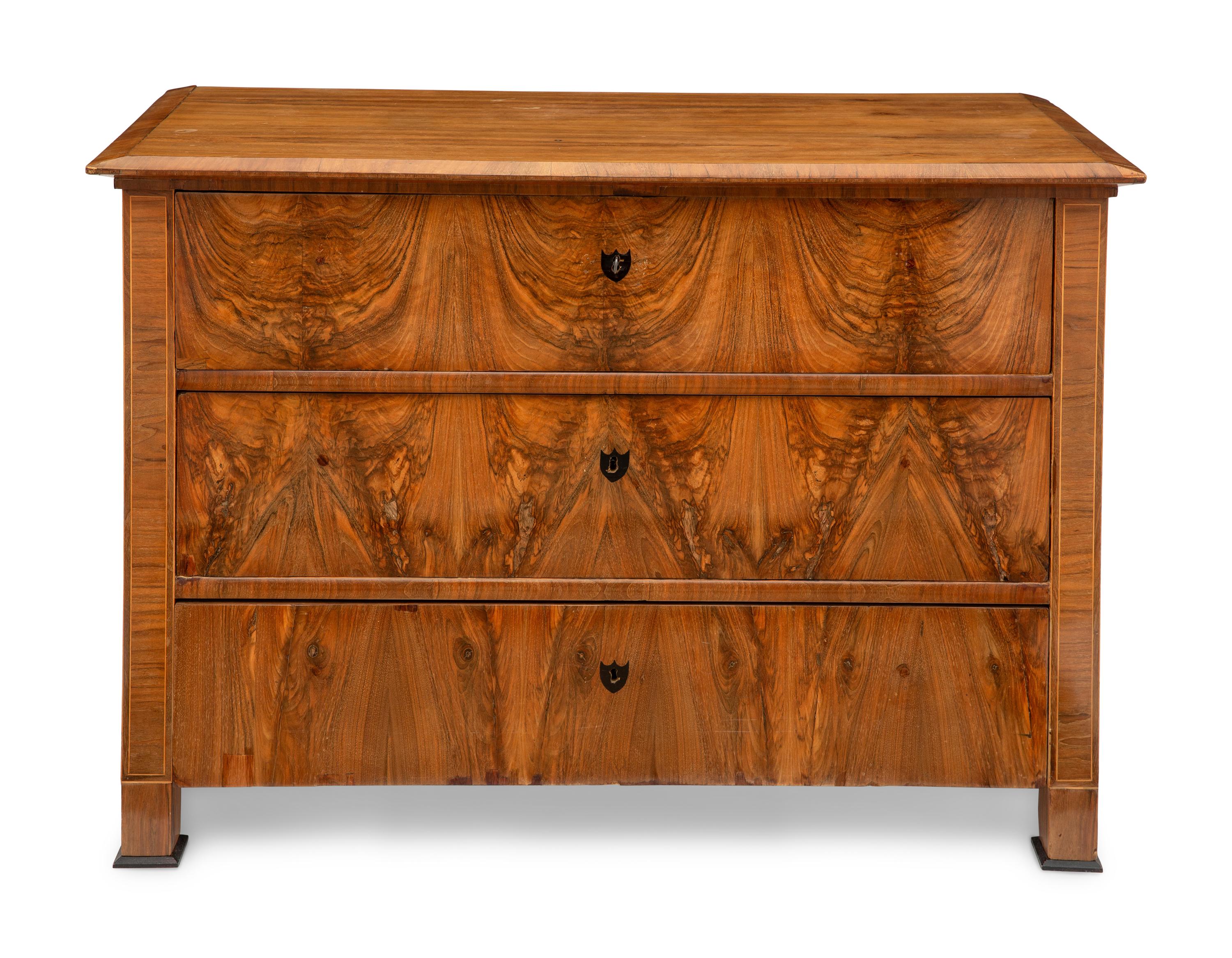 A Biedermeier Walnut Commode