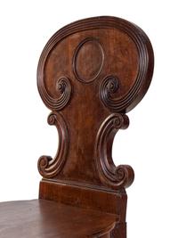 A Pair of Regency Style Mahogany Hall Chairs