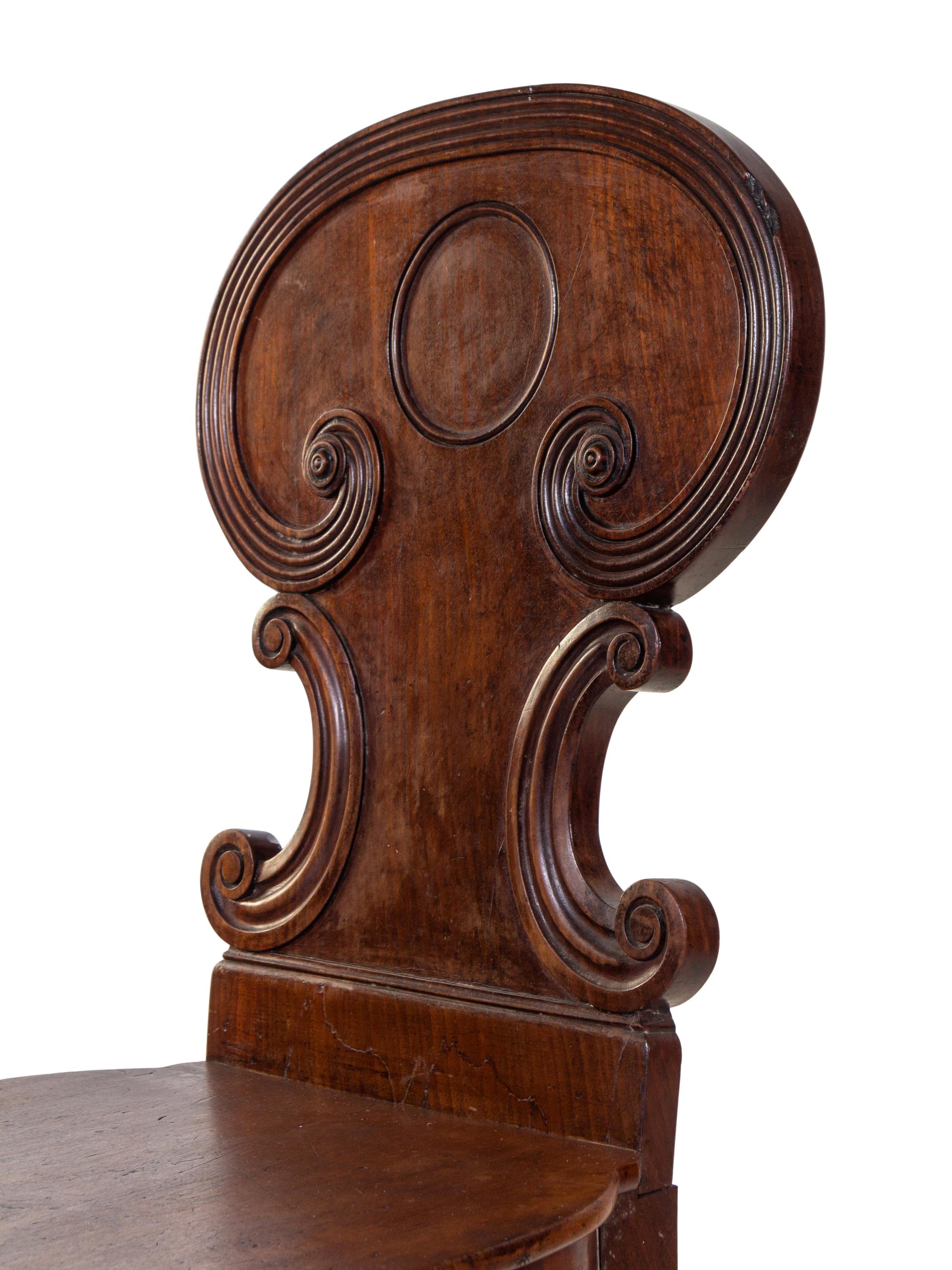 A Pair of Regency Style Mahogany Hall Chairs