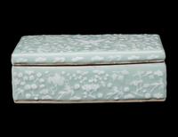 Two Chinese Carved Porcelain Covered Boxes