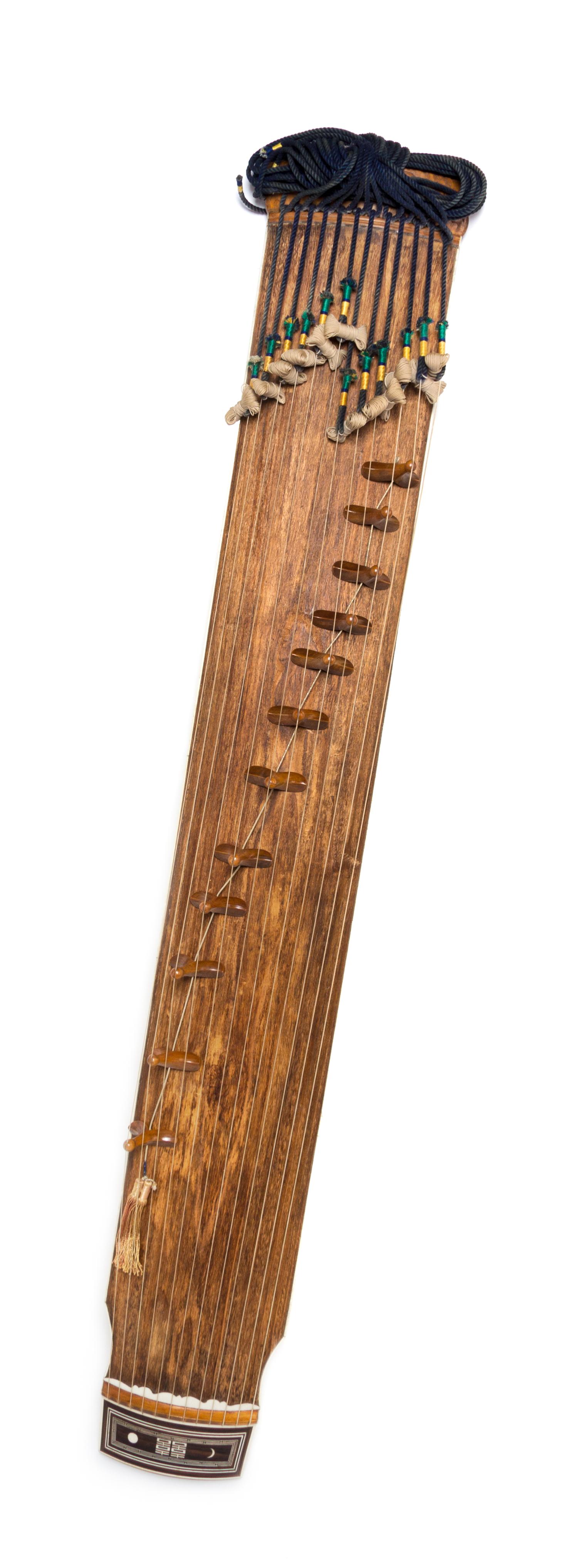 A Wood Musical Instrument, Kayagum Length 57 1/2 x width 8 1/2 inches.
