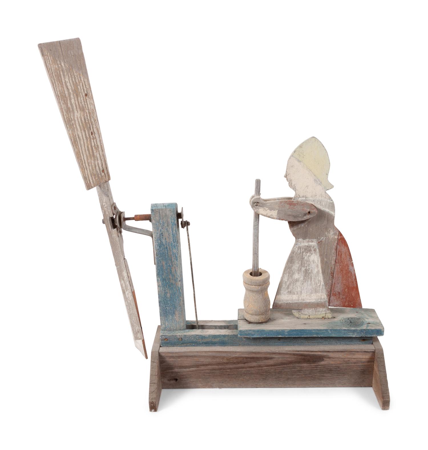 A Folk Art Carved and Painted Wood Butter Churn Whirligig