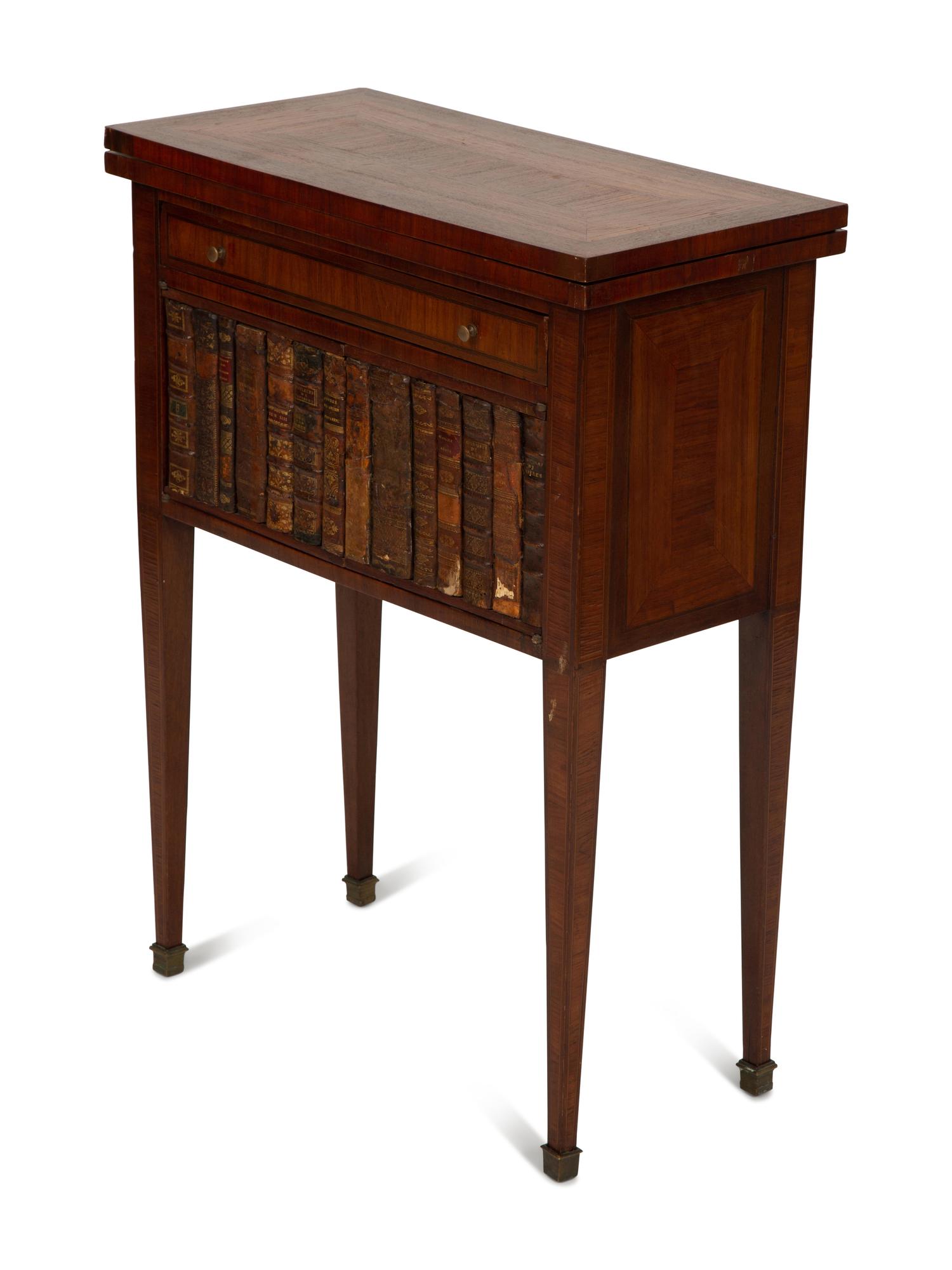 A Directoire Style Mahogany and Rosewood Small Cabinet with Faux-Leather Book Doors