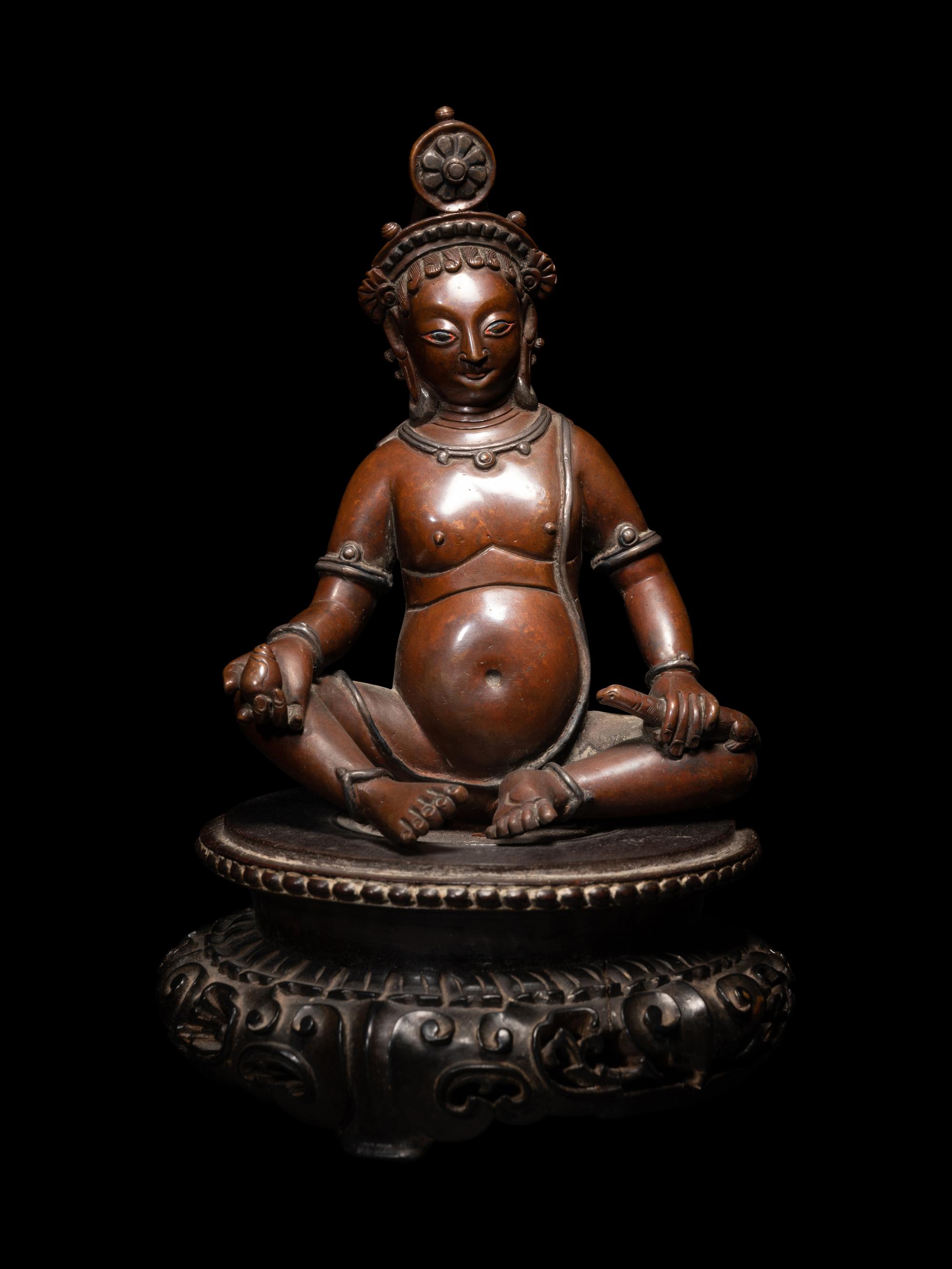 A Nepalese Bronze and Silver Figure of Seated Kubera