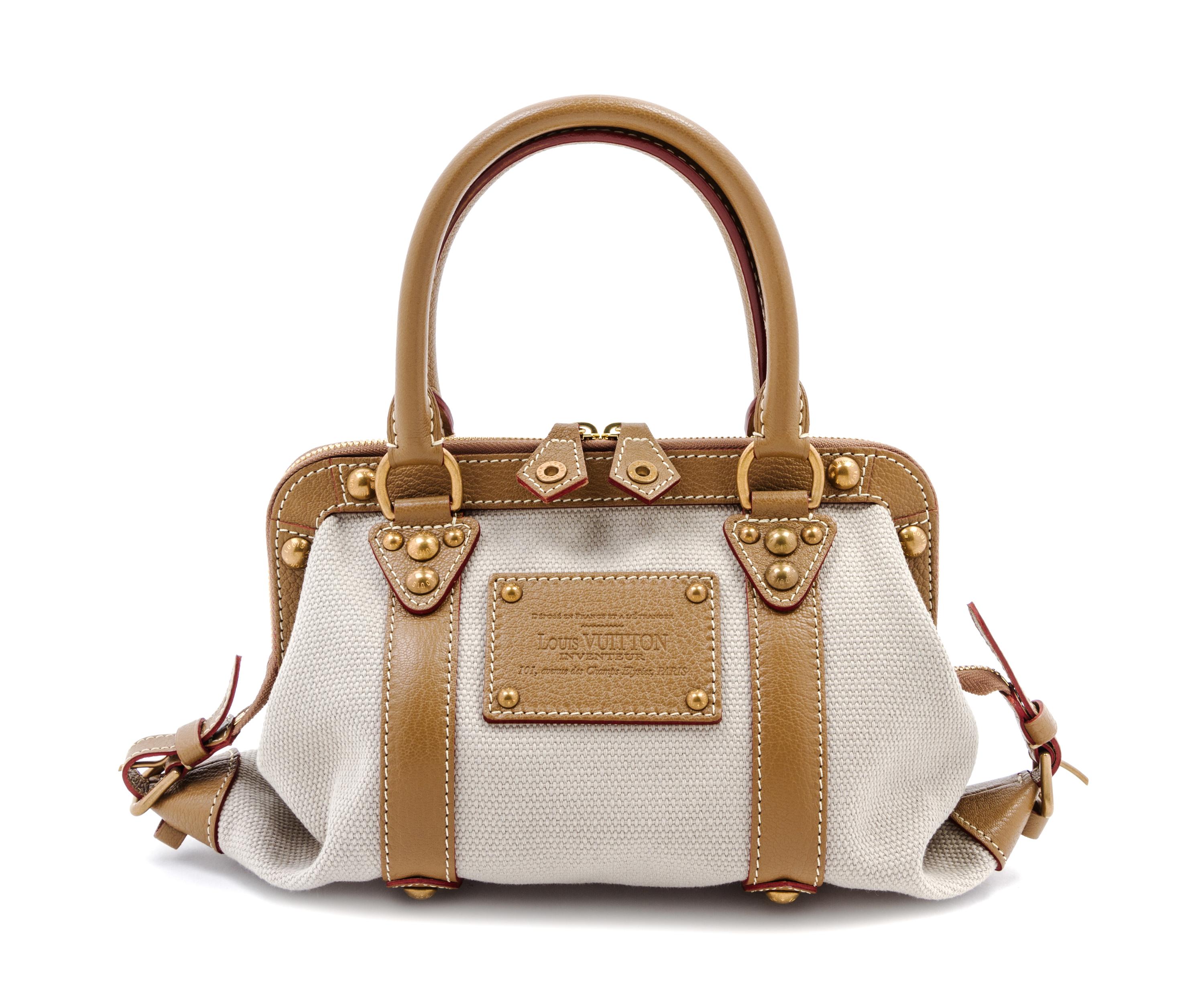 A Louis Vuitton Toile Trianon Canvas Leather Inventeur Sac de Nuit Bag, 13 x 6 x 6 inches.