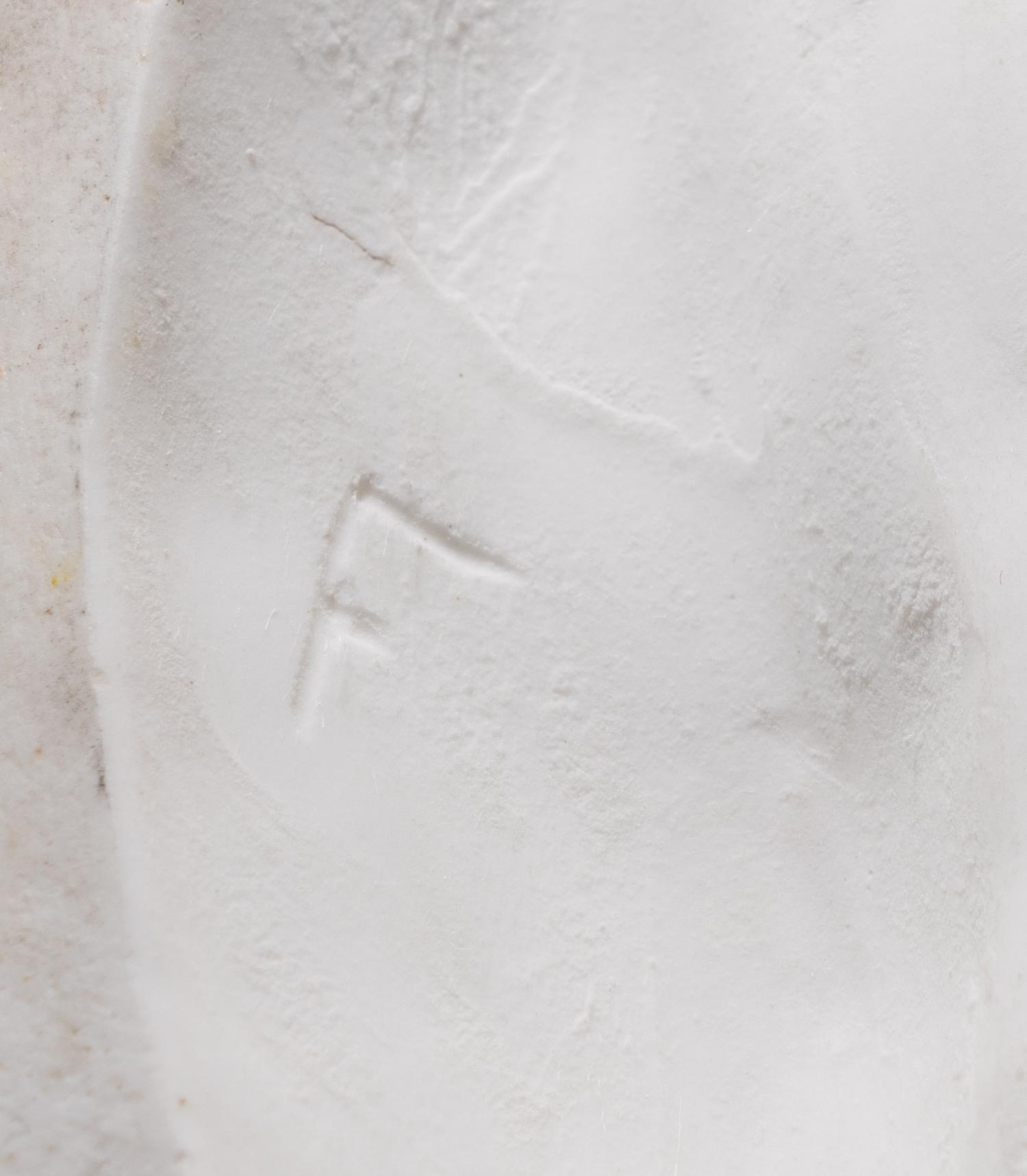 A Sèvres White Biscuit Porcelain Figure of 'La Petit Fille au Tablier'