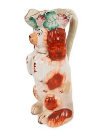 A Group of Staffordshire Porcelain and Pottery Models of Dogs
