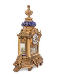 A French Porcelain Mounted Gilt Bronze Clock