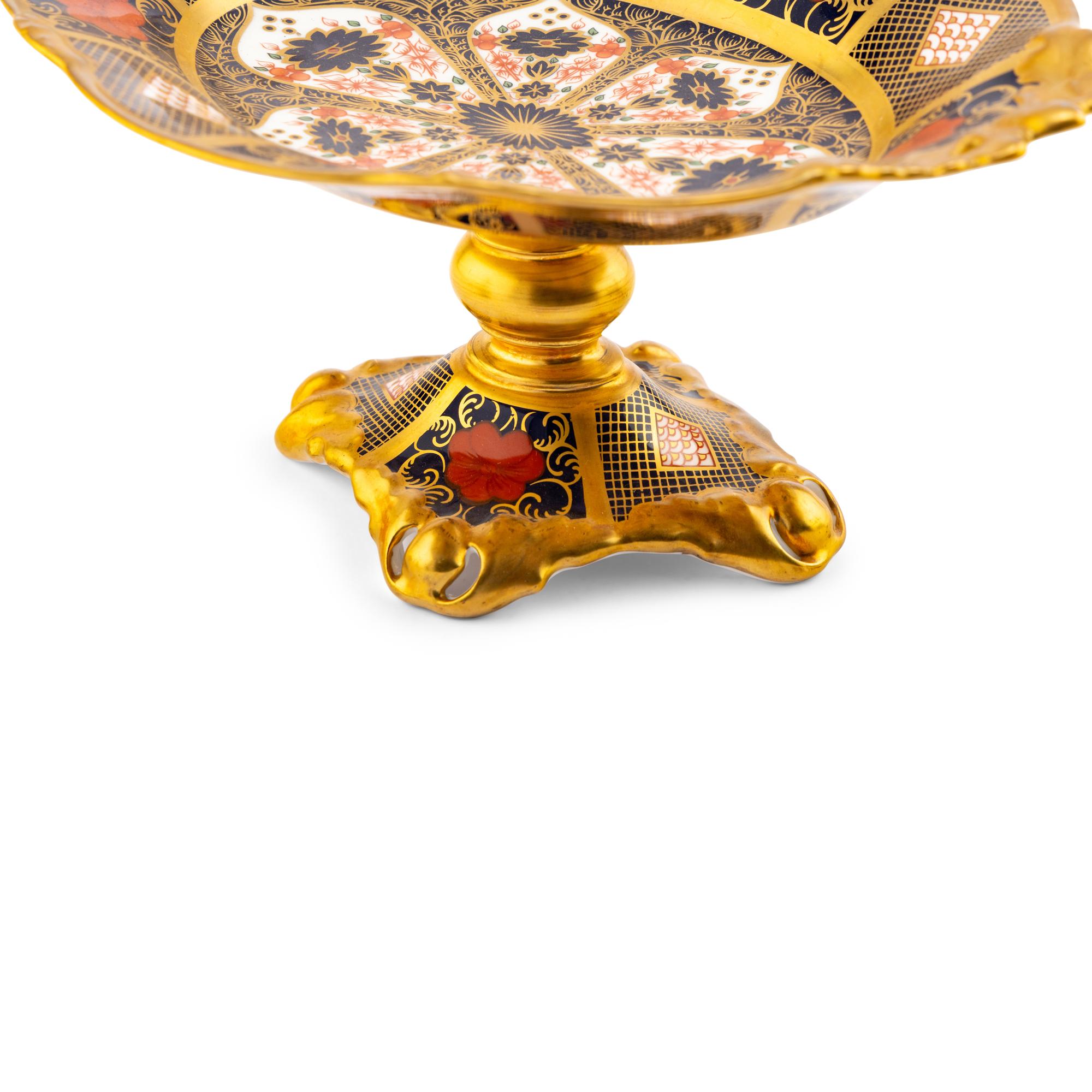 A Pair of Royal Crown Derby Imari Porcelain Candlesticks and a Tazza