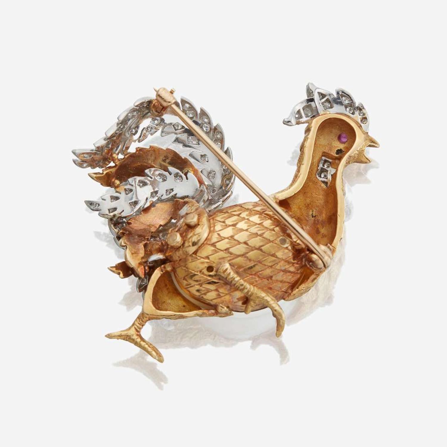 A bicolor gold, cultured pearl, diamond, and ruby brooch