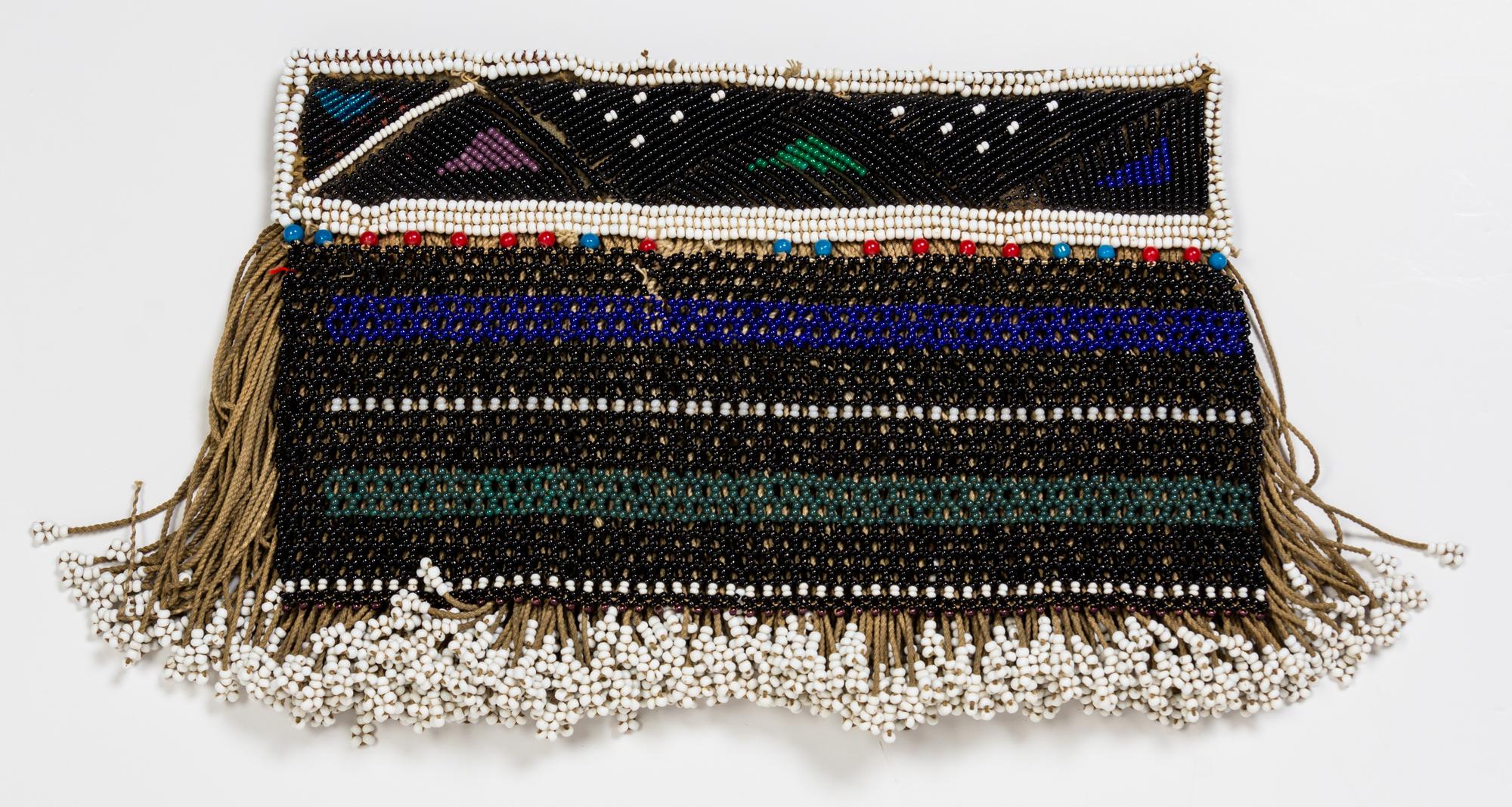 A Group of Four African Beaded Aprons Height of largest 21 1/2 x width 20 1/4 inches.