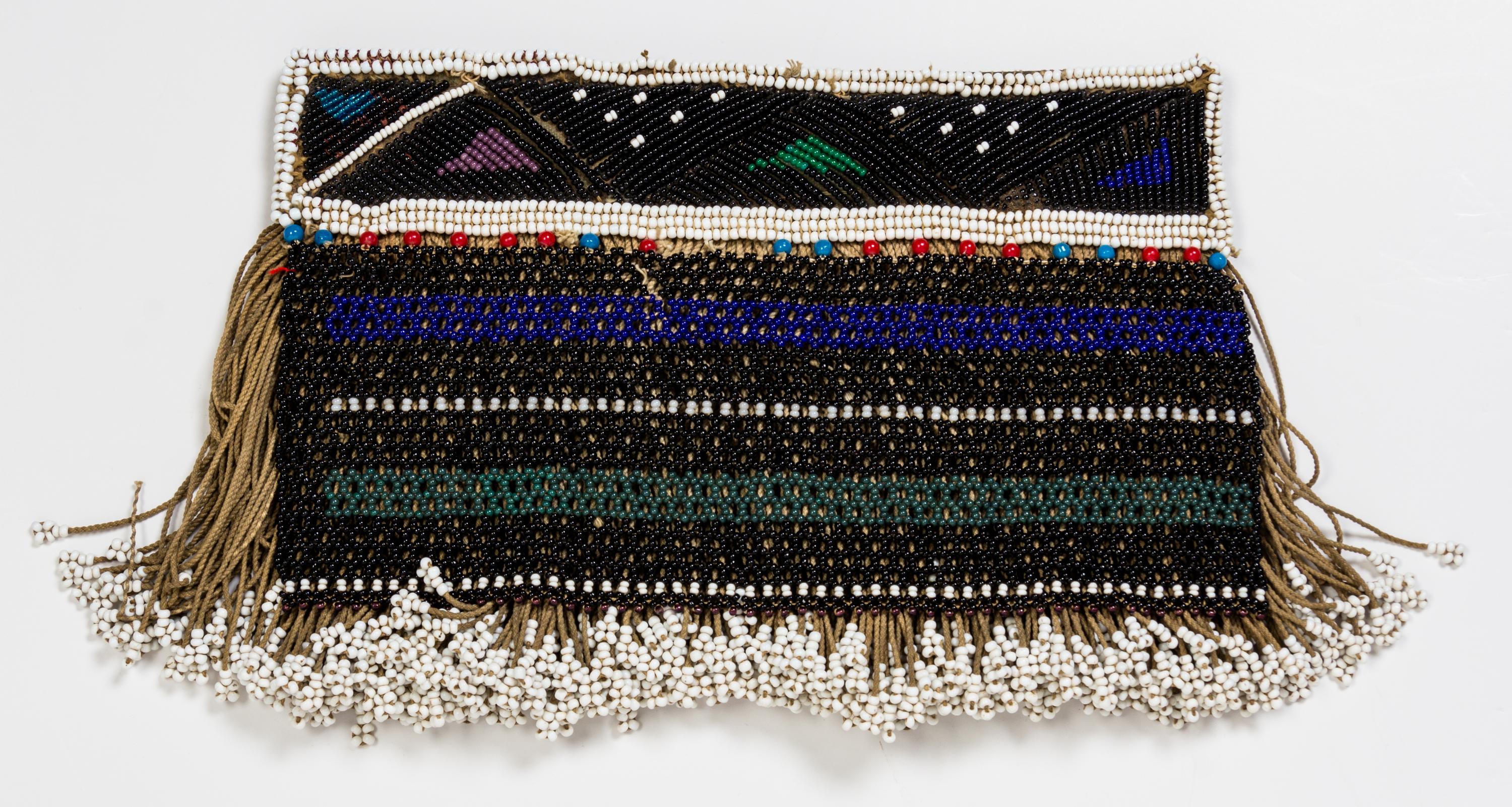 A Group of Four African Beaded Aprons Height of largest 21 1/2 x width 20 1/4 inches.