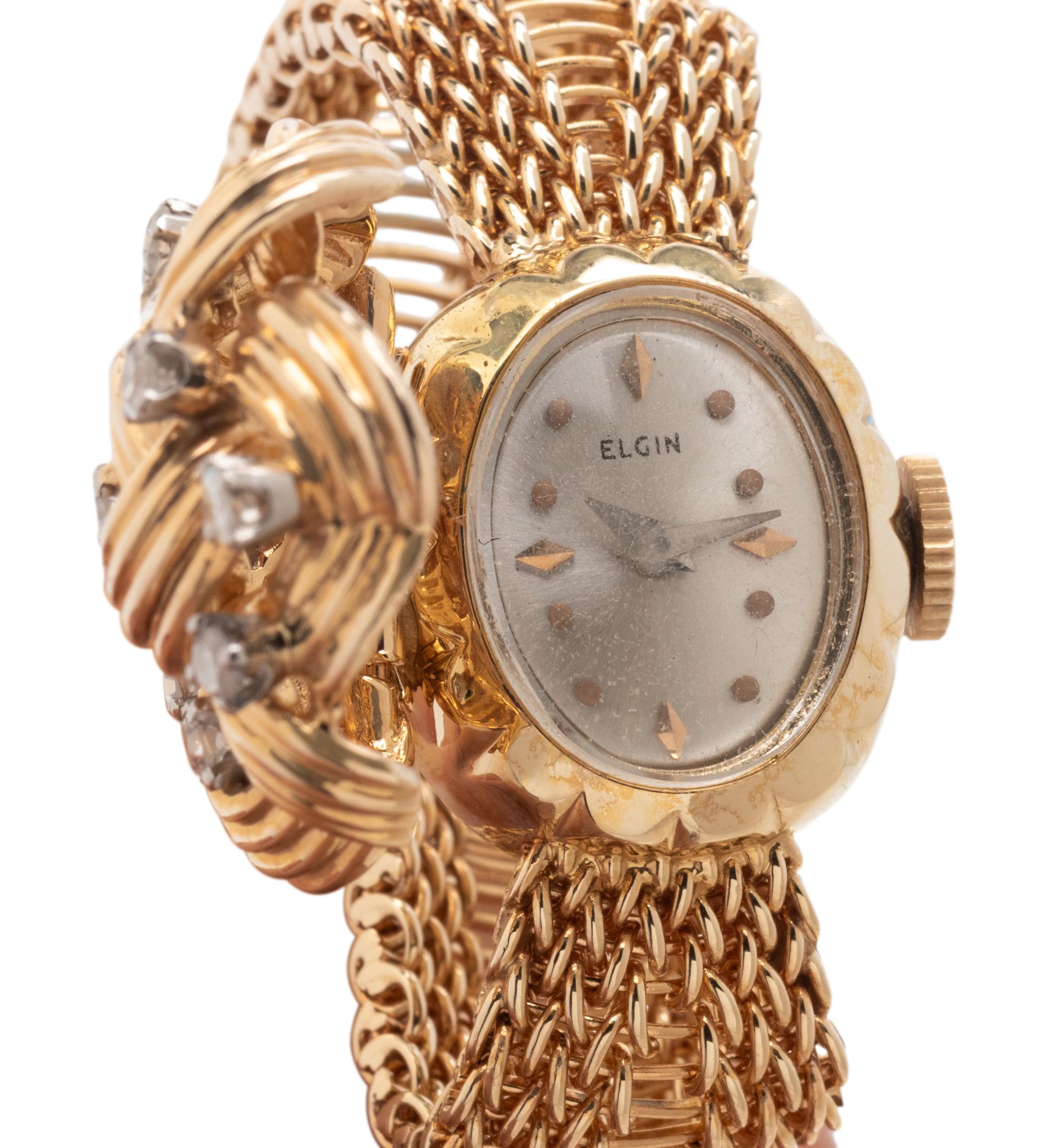 ELGIN, YELLOW GOLD AND DIAMOND SURPRISE WATCH