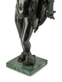 A Continental Patinated Bronze Figure with a Rock Crystal Ornament