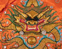 Two Chinese Orange Ground Embroidered Silk Theatrical Robes and A Cape