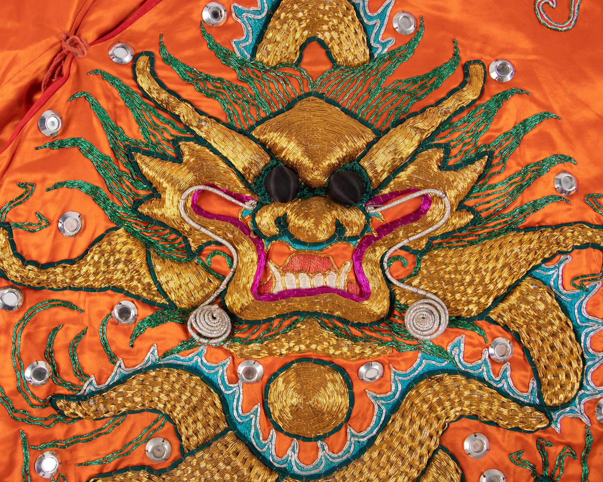 Two Chinese Orange Ground Embroidered Silk Theatrical Robes and A Cape