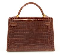 An Hermès Brown Niloticus Crocodile Sellier 32cm Kelly Handbag, 12.5" x 5" x 9.5"; Handle drop: 3.25".